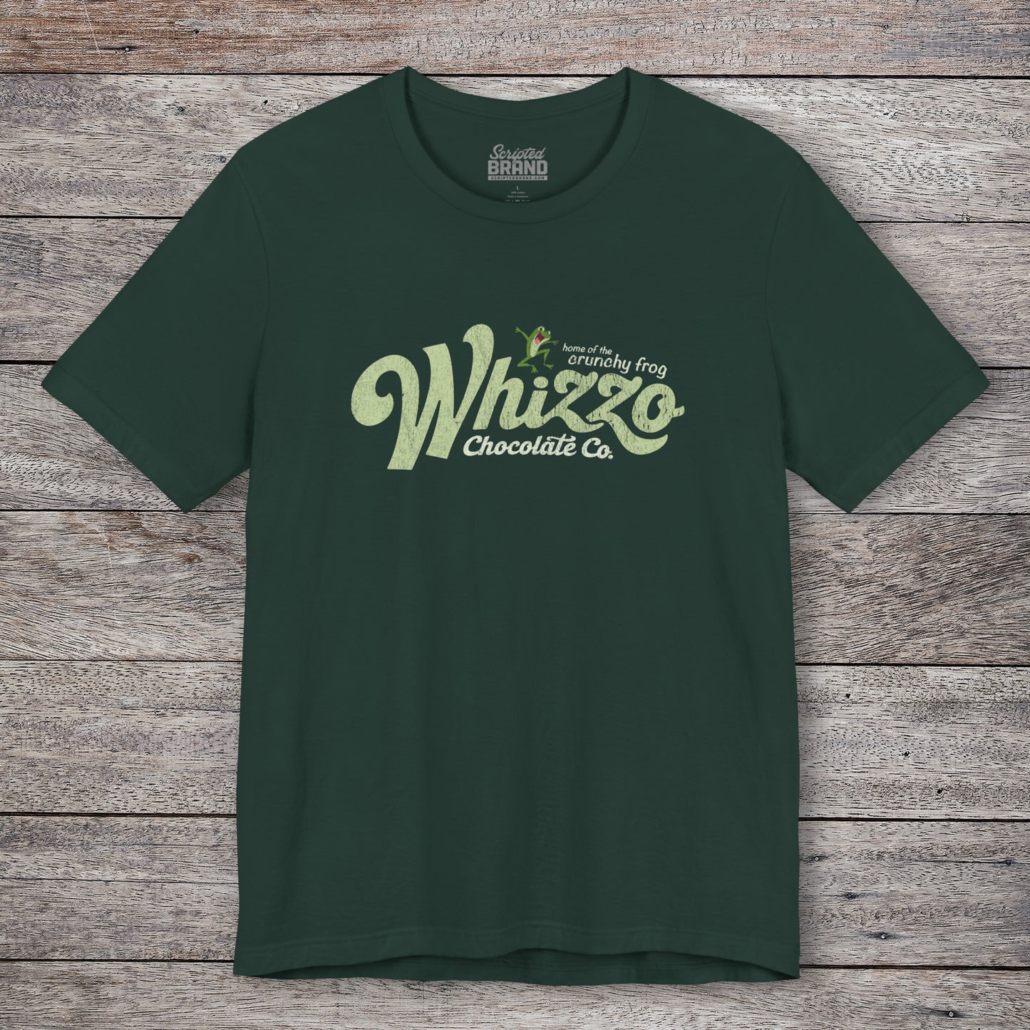 Forest green t-shirt with vintage Whizzo Chocolate Co. logo, inspired by Monty Python, featuring “home of the crunchy frog” graphic.