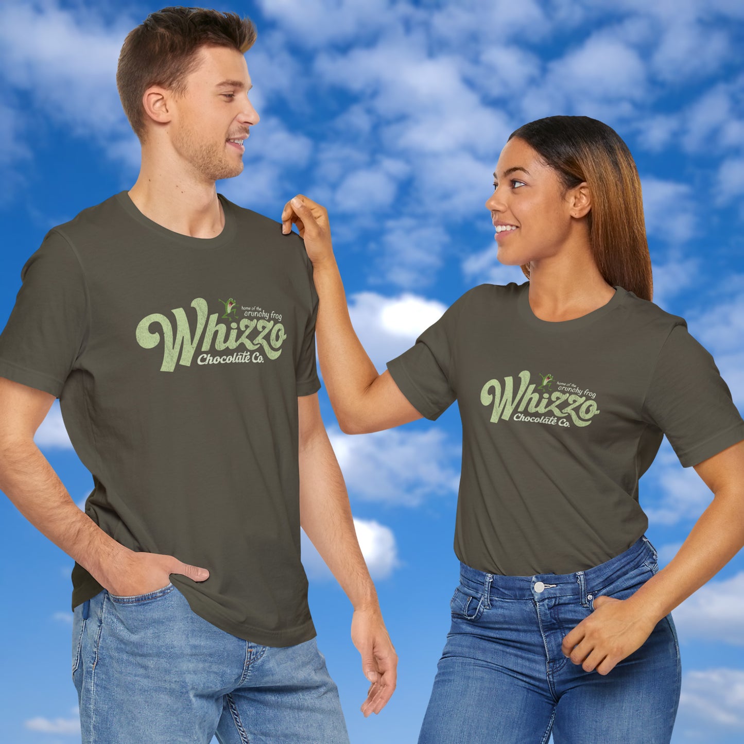 2 models wearing t-shirts with vintage Whizzo Chocolate Co. logo, inspired by Monty Python, featuring “home of the crunchy frog” graphic.
