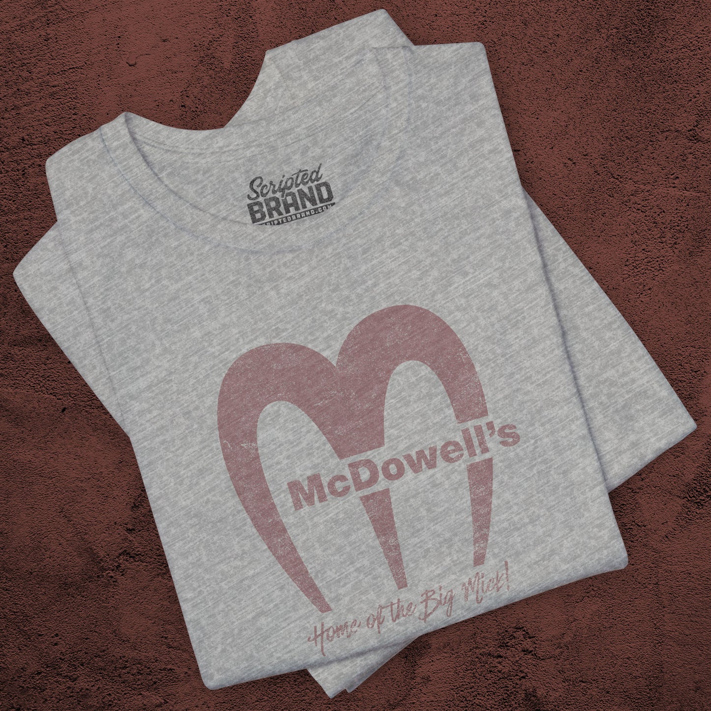 Heather gray t-shirt featuring the McDowells logo from the movie Coming to America in a vintage distressed style.