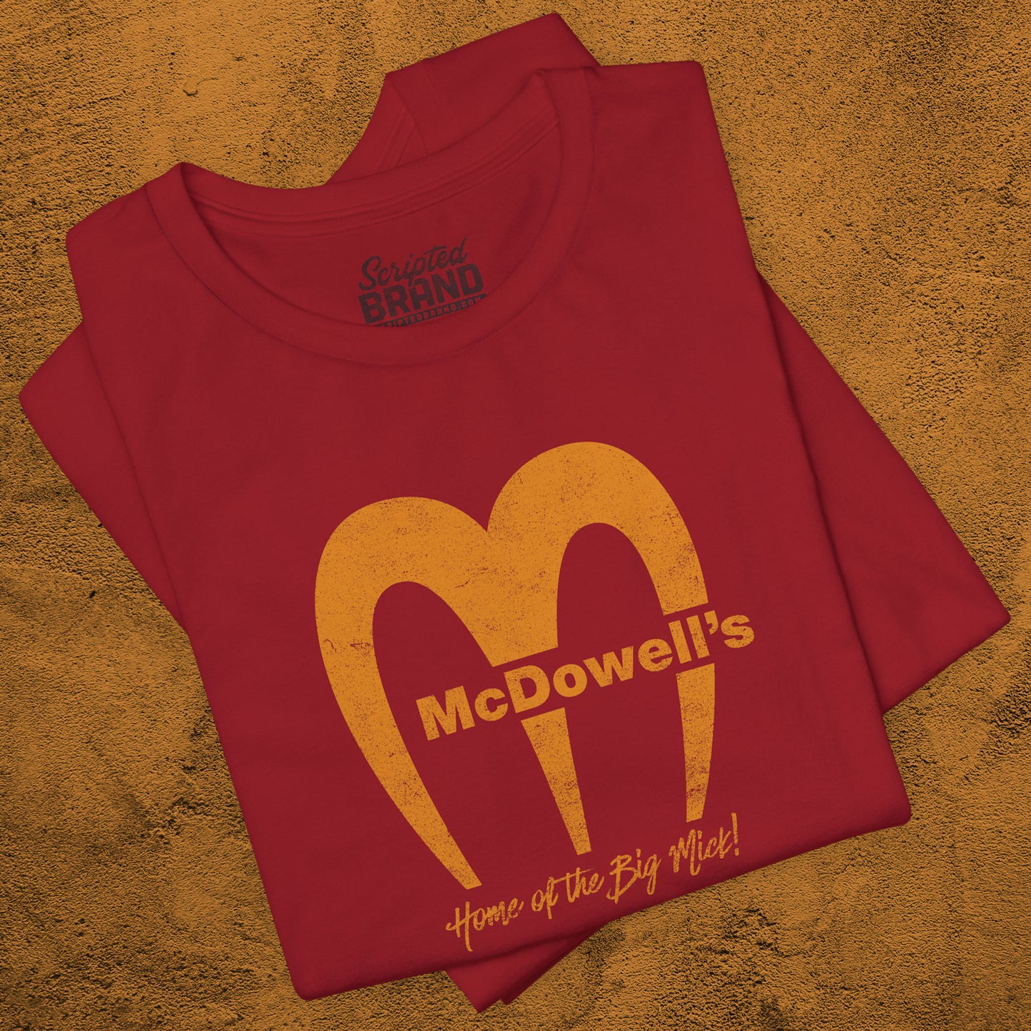 Canvas Red t-shirt featuring the McDowells logo from the movie Coming to America in a vintage distressed style.