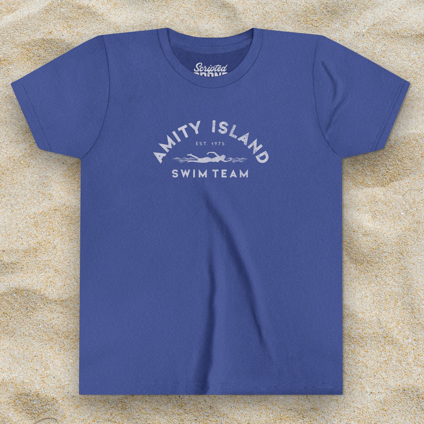 Front view of a Heather royal blue colored Soft unisex Youth Sizes Bella+Canvas 3001Y short-sleeve t-shirt featuring an Amity Island Swim Team logo graphic, designed by ScriptedBrand, and inspired by the movie Jaws in a vintage distressed style.