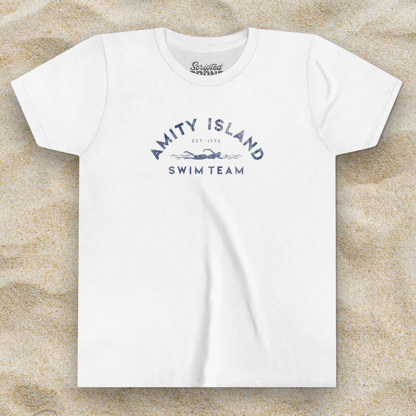 Front view of a white colored Soft unisex Youth Sizes Bella+Canvas 3001Y short-sleeve t-shirt featuring an Amity Island Swim Team logo graphic, designed by ScriptedBrand, and inspired by the movie Jaws in a vintage distressed style.