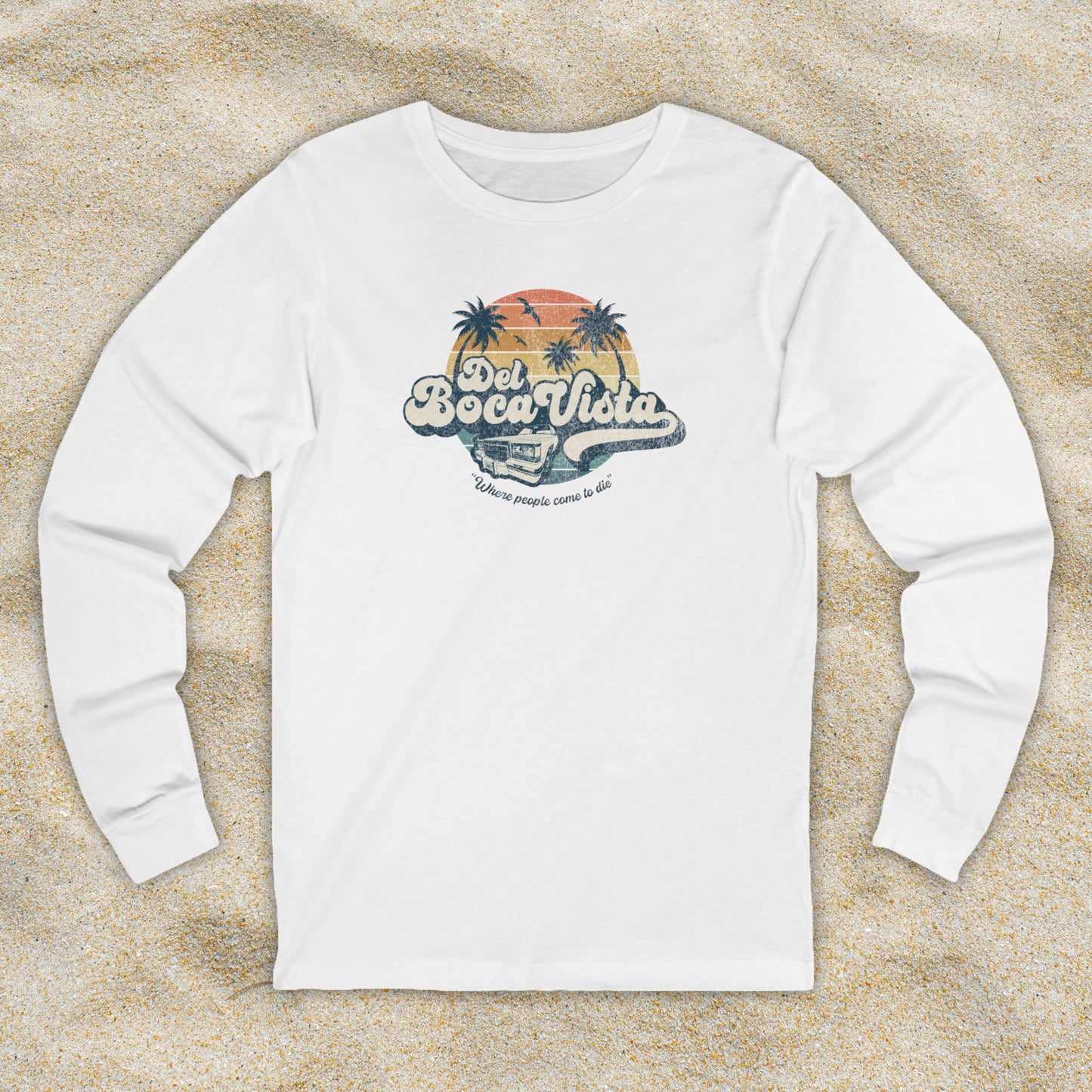 Front view of a white Soft Bella+Canvas 3501 long-sleeve t-shirt featuring a Del Boca Vista logo graphic (uniquely designed by ScriptedBrand), including the phrase Where People Come To Die, inspired by the TV show Seinfeld, in a vintage distressed style.