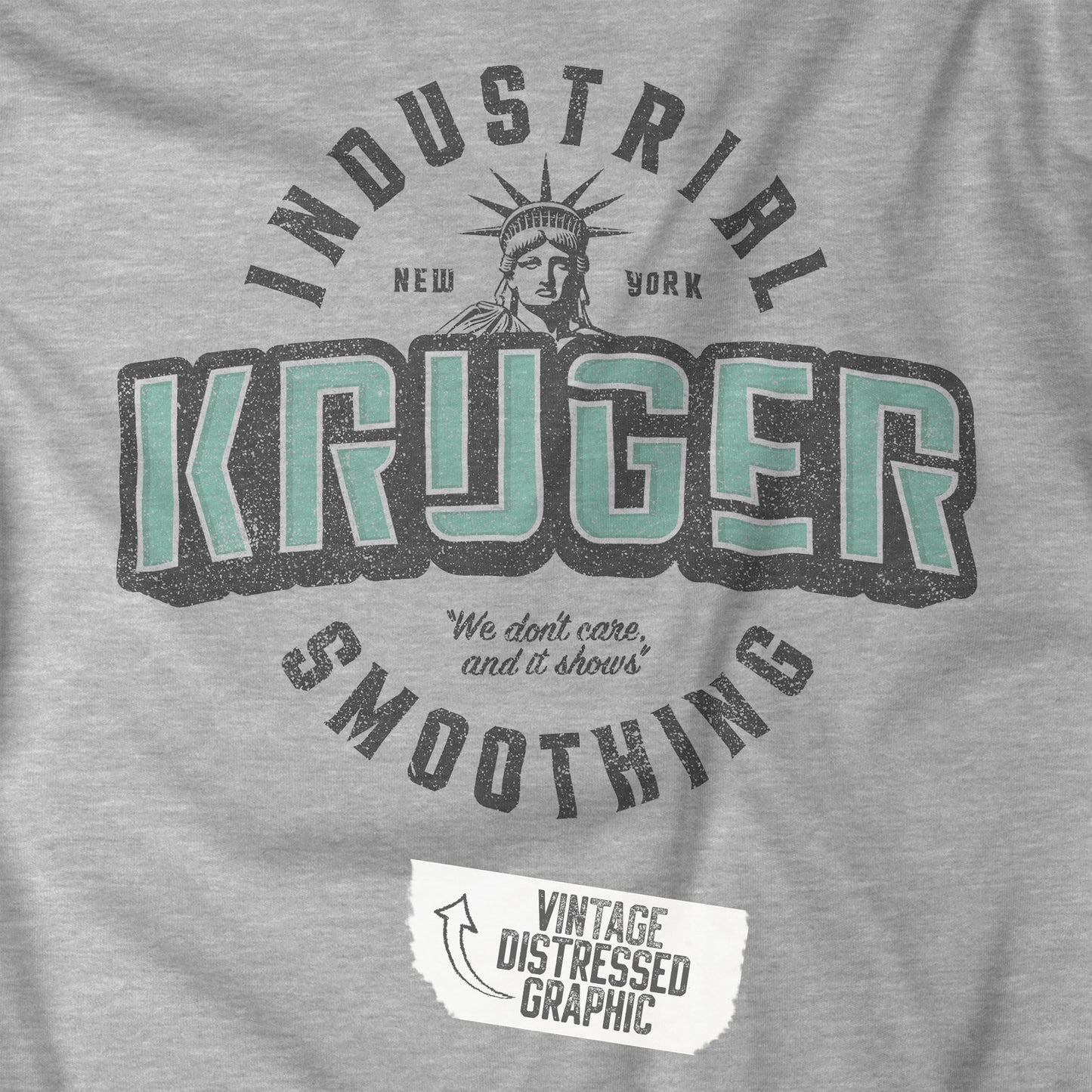 Closeup view of a grey athletic heather colored soft unisex Bella+Canvas 3501 long-sleeve t-shirt featuring a Kruger Industrial Smoothing logo graphic, designed by ScriptedBrand in a vintage distressed style, and inspired by the TV show Seinfeld. Includes the Statue of Liberty and the the slogan "We don't care and it shows".