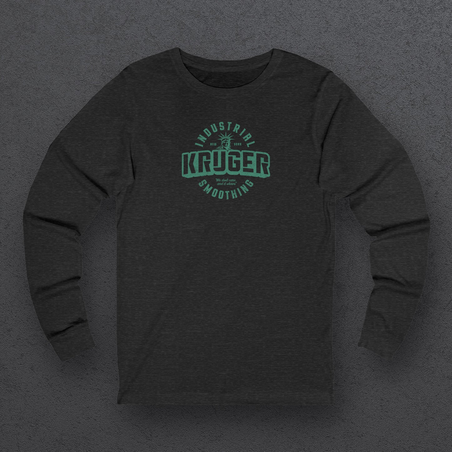 Front view of a deep heather colored soft unisex Bella+Canvas 3501 long-sleeve t-shirt featuring a Kruger Industrial Smoothing logo graphic, designed by ScriptedBrand in a vintage distressed style, and inspired by the TV show Seinfeld. Includes the Statue of Liberty and the the slogan "We don't care and it shows".