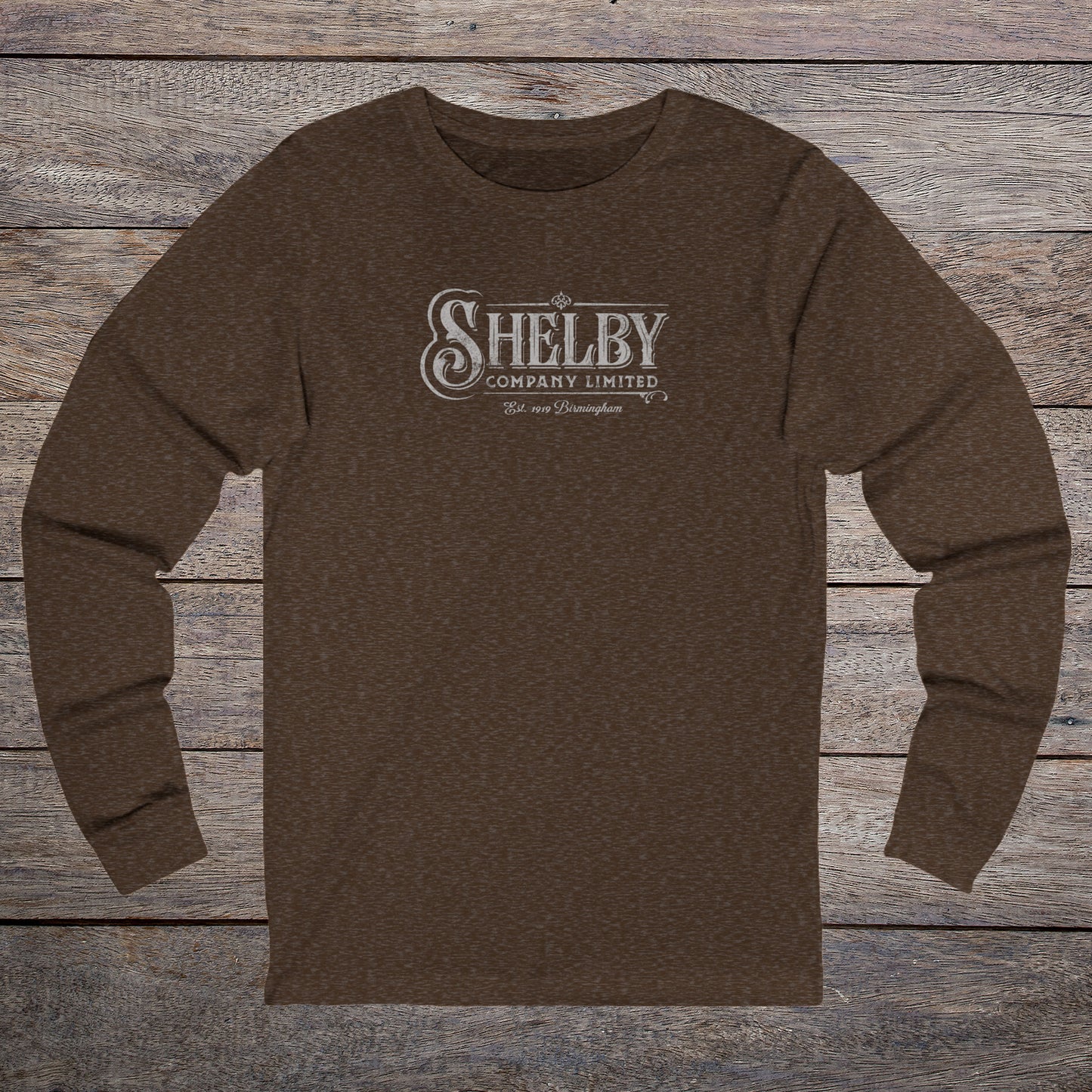 Front view of a brown heather soft unisex Bella-Canvas 3501 long-sleeve t-shirt featuring the Shelby Company Limited logo from the show Peaky Blinders in a vintage distressed style, sold by ScriptedBrand.