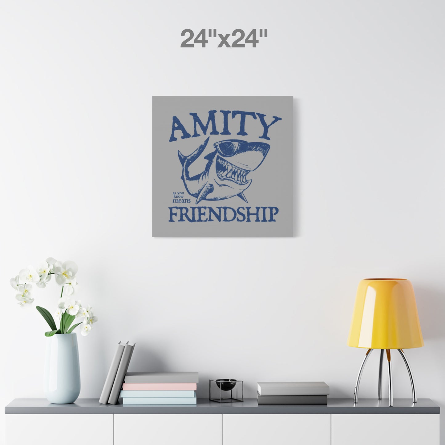 24 x 24 Funny Amity Island shark wall art canvas print inspired by Jaws with “Amity Means Friendship” and shark in sunglasses.