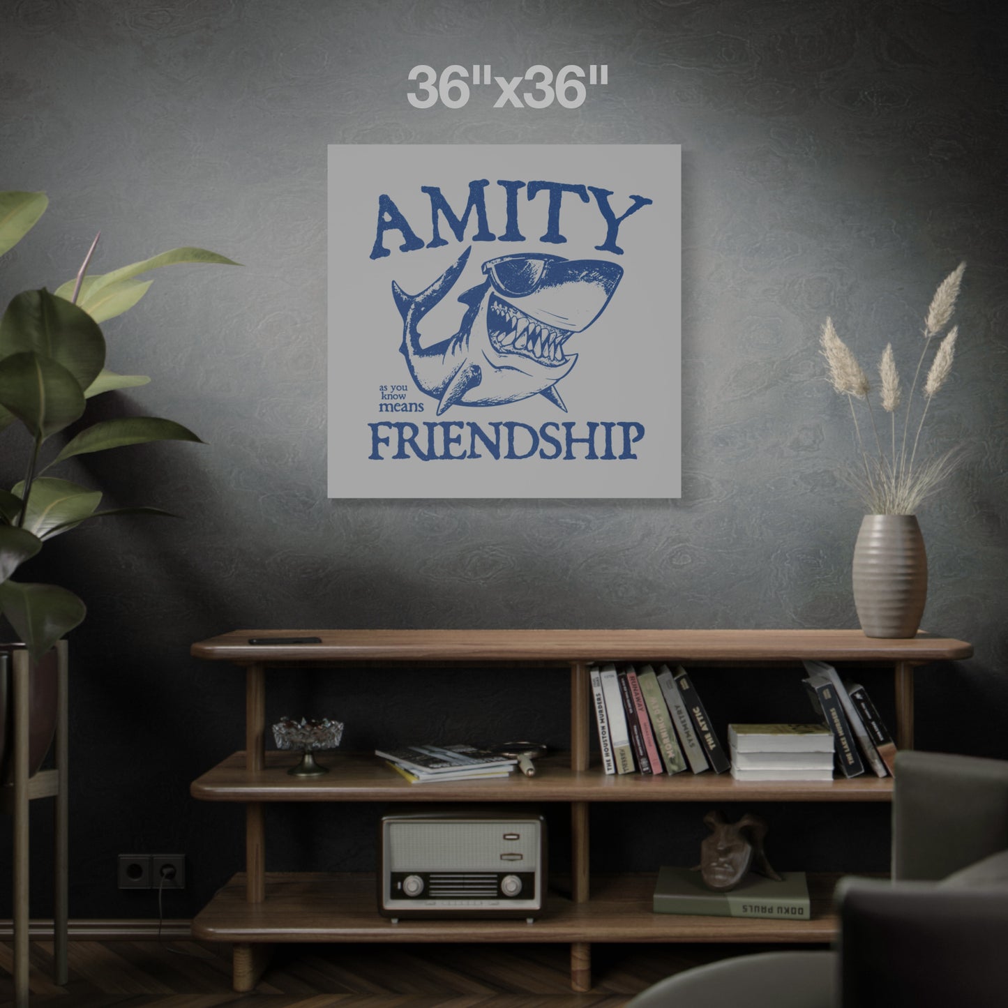 36 x 36 Funny Amity Island shark wall art canvas print inspired by Jaws with “Amity Means Friendship” and shark in sunglasses, on a dark wall