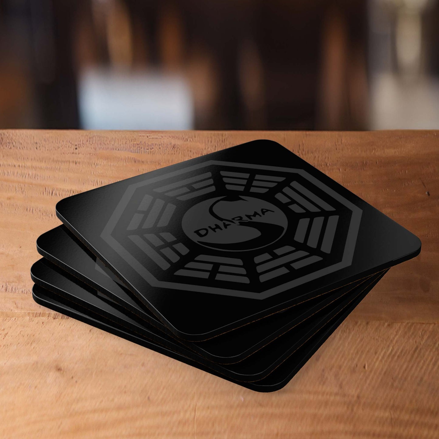 Angled view of Set of 4 Corkwood Coasters featuring the Dharma Initiative Swan Station logo graphic from the TV show LOST.