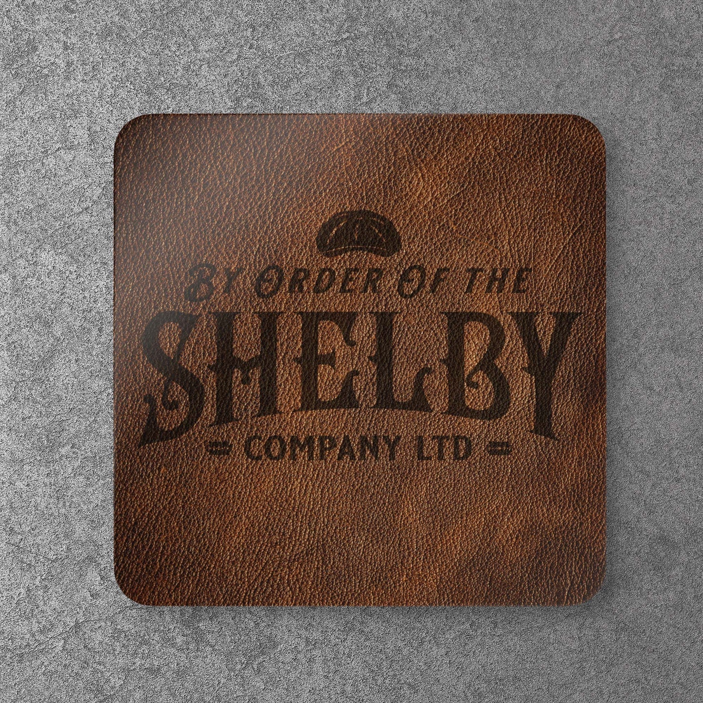Single corkwood drink coaster with Shelby Company LTD logo from Peaky Blinders in vintage leather-style print.