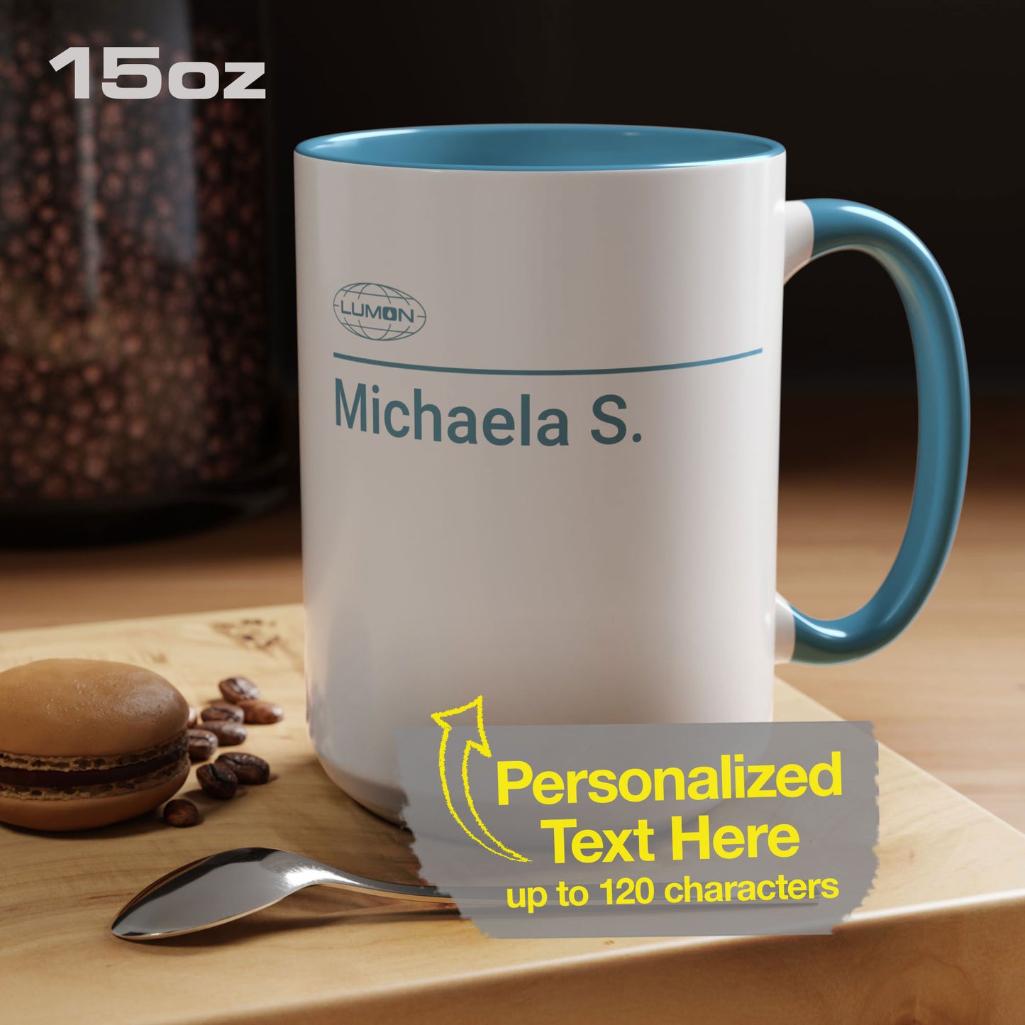 Mockup of a White Ceramic Mug (15 oz) with the blue Lumon Industries logo on one side and customizable text on the other side (up to 120 characters) inspired by the Apple TV show Severance. The custom text is "Michaela S."