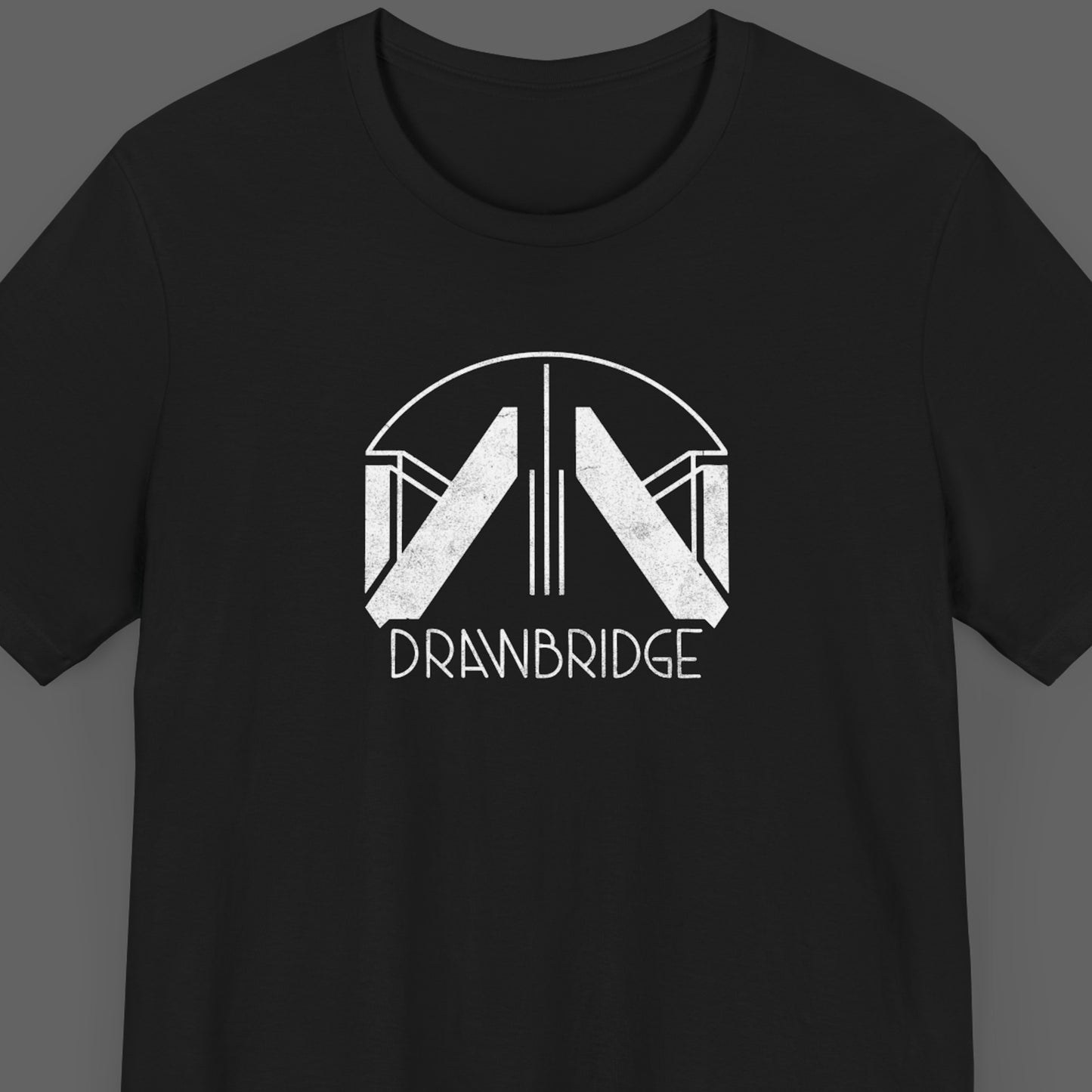 Front view of a black colored soft Bella+Canvas 3001 short-sleeve t-shirt tee featuring the Drawbridge logo from the video game Death Stranding 2, in a vintage distressed style, sold by ScriptedBrand.