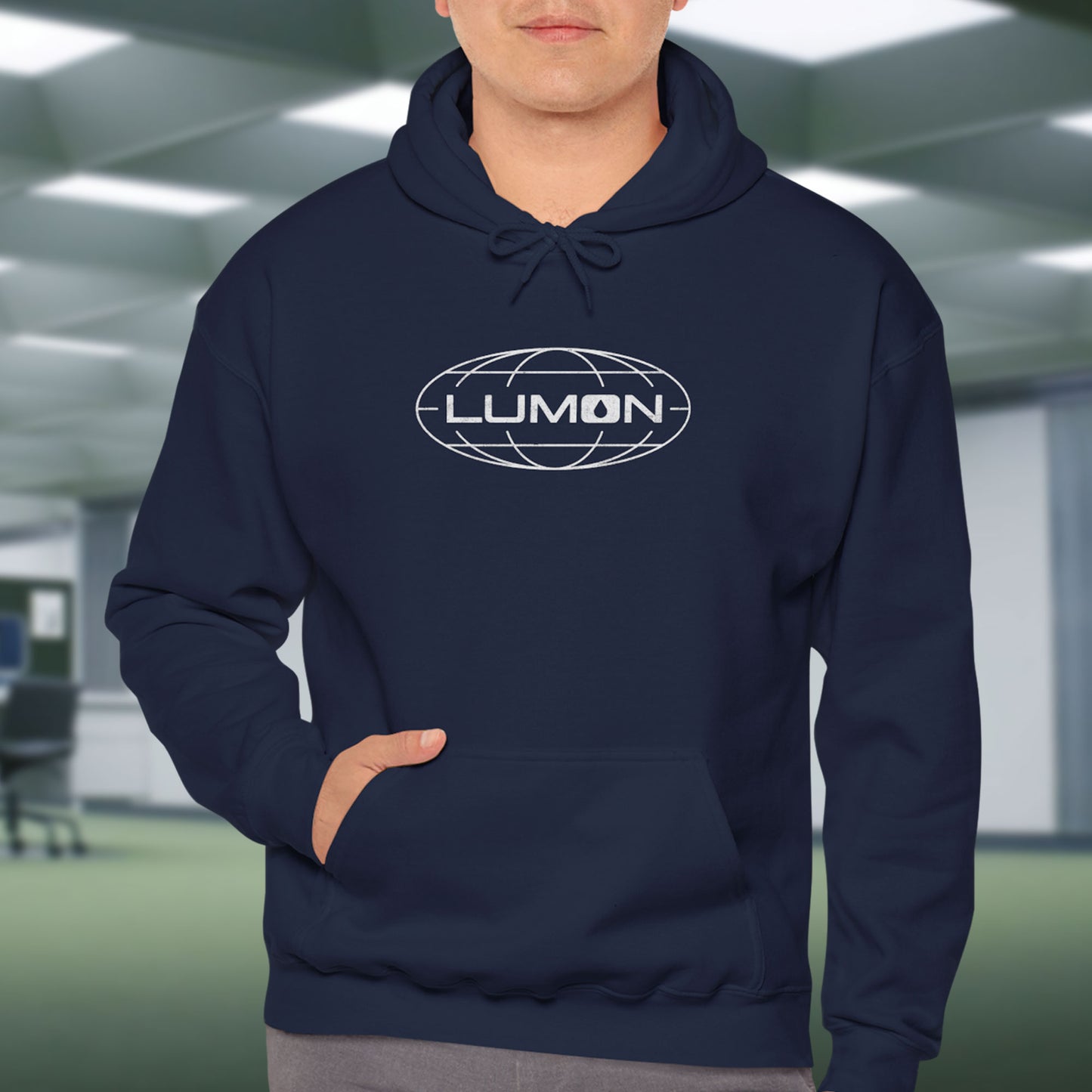 Male Model wearing a navy blue colored Soft Unisex Heavy Blend Hooded Sweatshirt featuring the fictional Lumon Industries logo from the Apple TV show Severance.