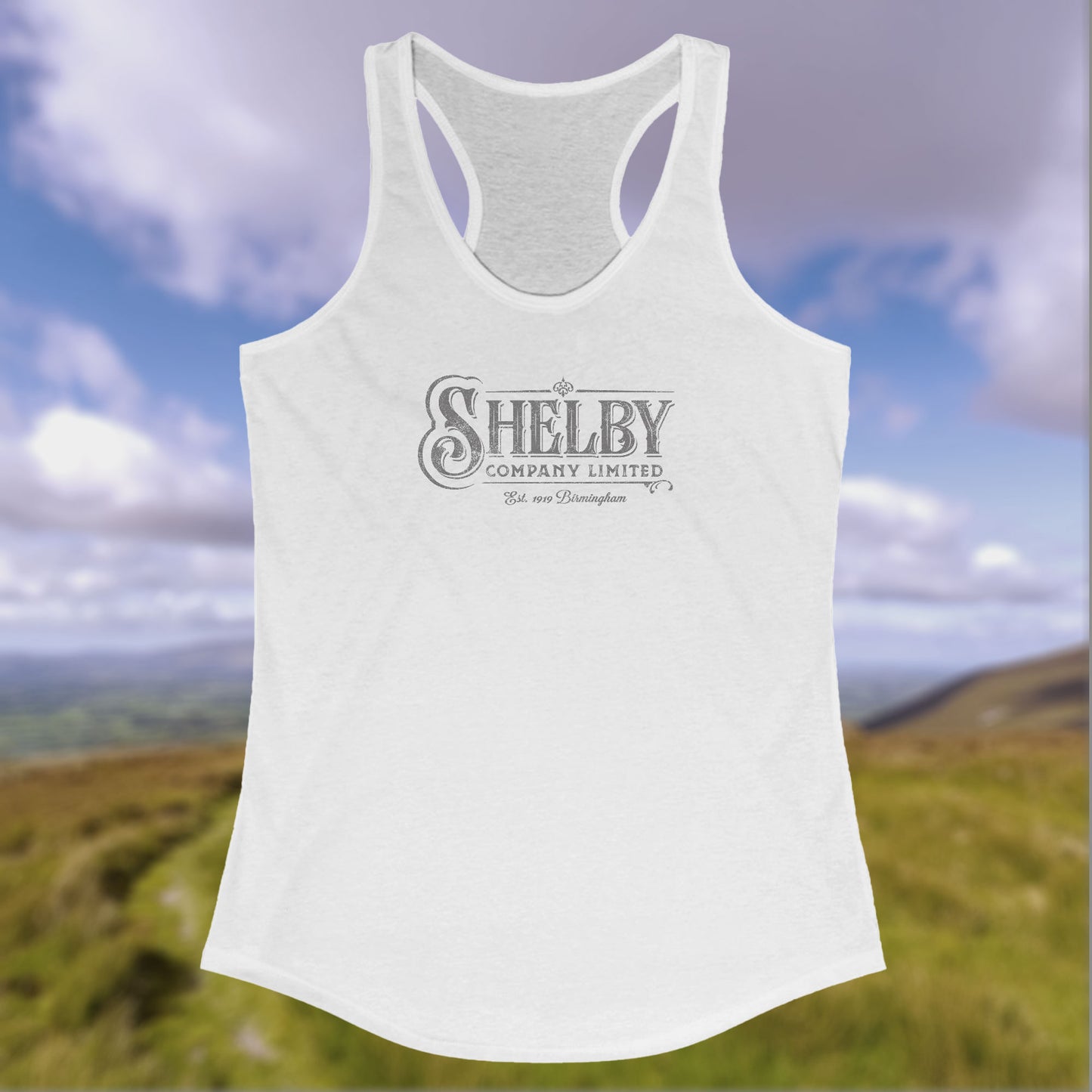 Front view of a white colored Women's Racerback Tank Top Shirt (Next Level 1533) featuring the Shelby Company LTD logo from the show Peaky Blinders in a vintage distressed style, sold by ScriptedBrand.