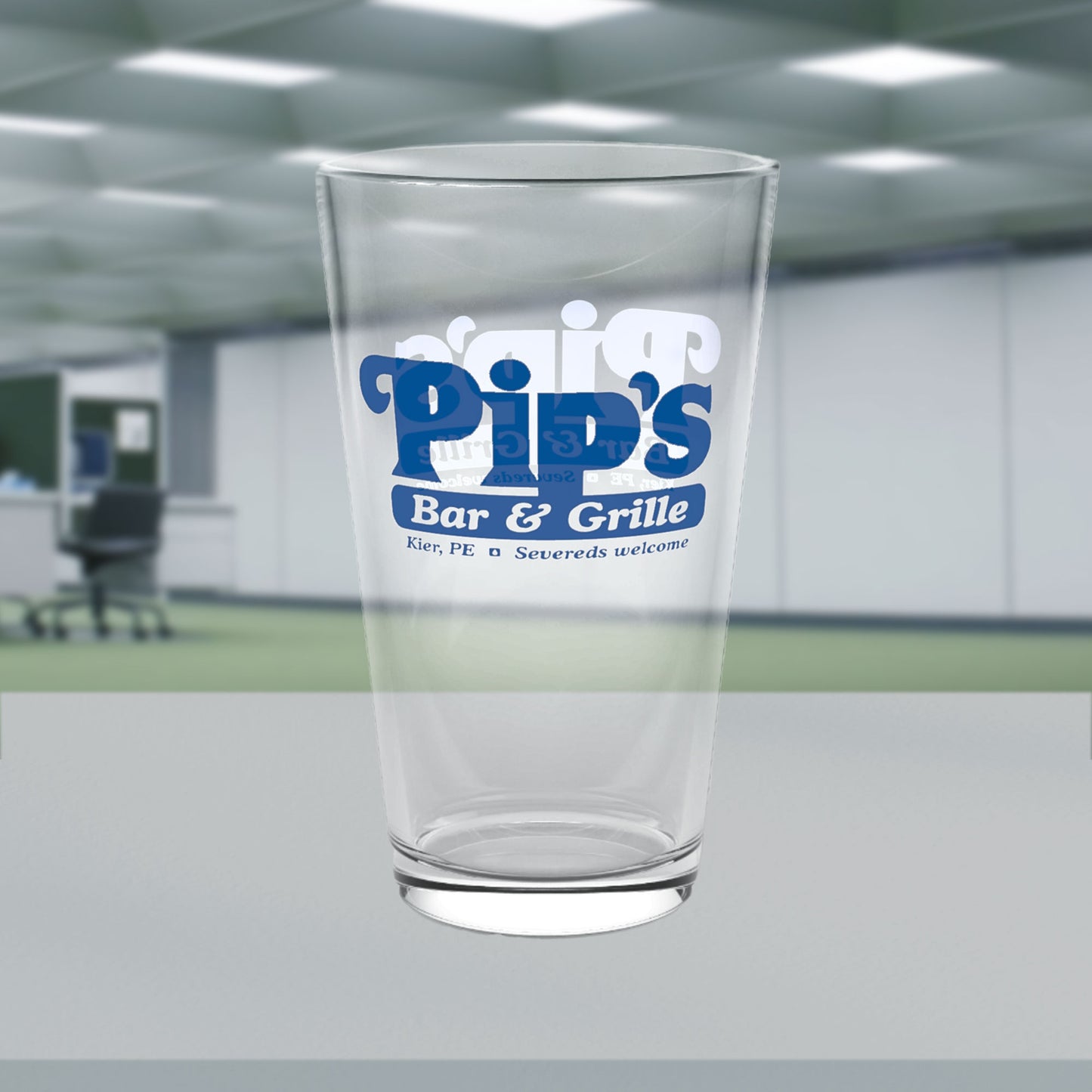 16 ounce clear pint glass featuring the Pip's Bar & Grill logo from the Apple TV show Severance printed on both sides.