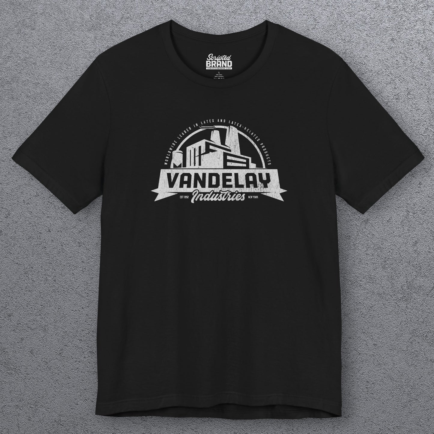 Front view of a black Soft Bella+Canvas 3001 short-sleeve t-shirt tee featuring a Vandelay Industries logo graphic, uniquely designed by ScriptedBrand in a vintage distressed style. The fictional company is part of the George Costanza storyline in the TV show Seinfeld.
