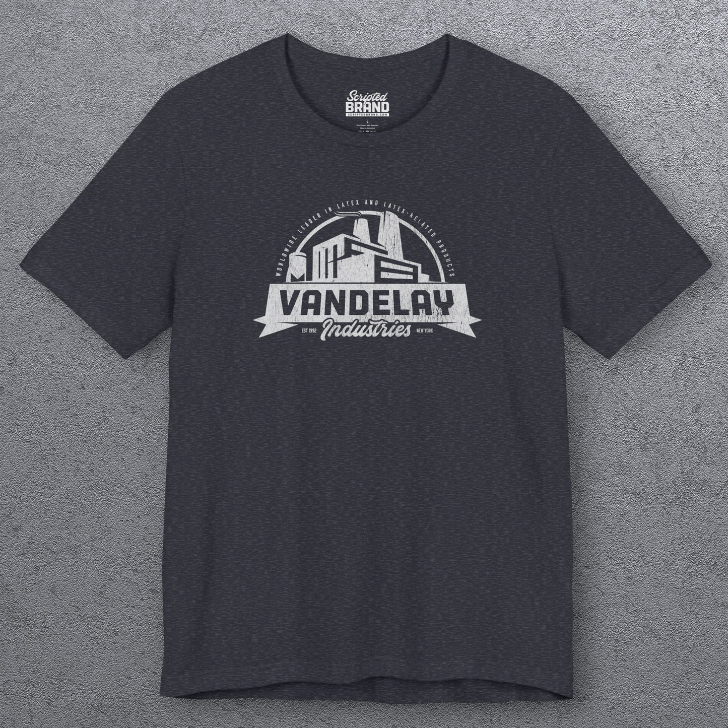Front view of a heather navy Soft Bella+Canvas 3001 short-sleeve t-shirt tee featuring a Vandelay Industries logo graphic, uniquely designed by ScriptedBrand in a vintage distressed style. The fictional company is part of the George Costanza storyline in the TV show Seinfeld.