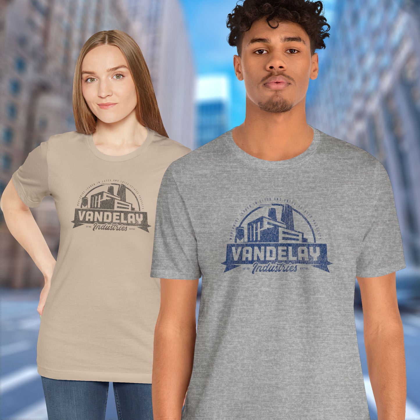 2 models wearing grey and tan Soft Bella+Canvas 3001 short-sleeve t-shirts featuring a Vandelay Industries logo graphic, uniquely designed by ScriptedBrand in a vintage distressed style. The fictional company is part of the George Costanza storyline in the TV show Seinfeld.