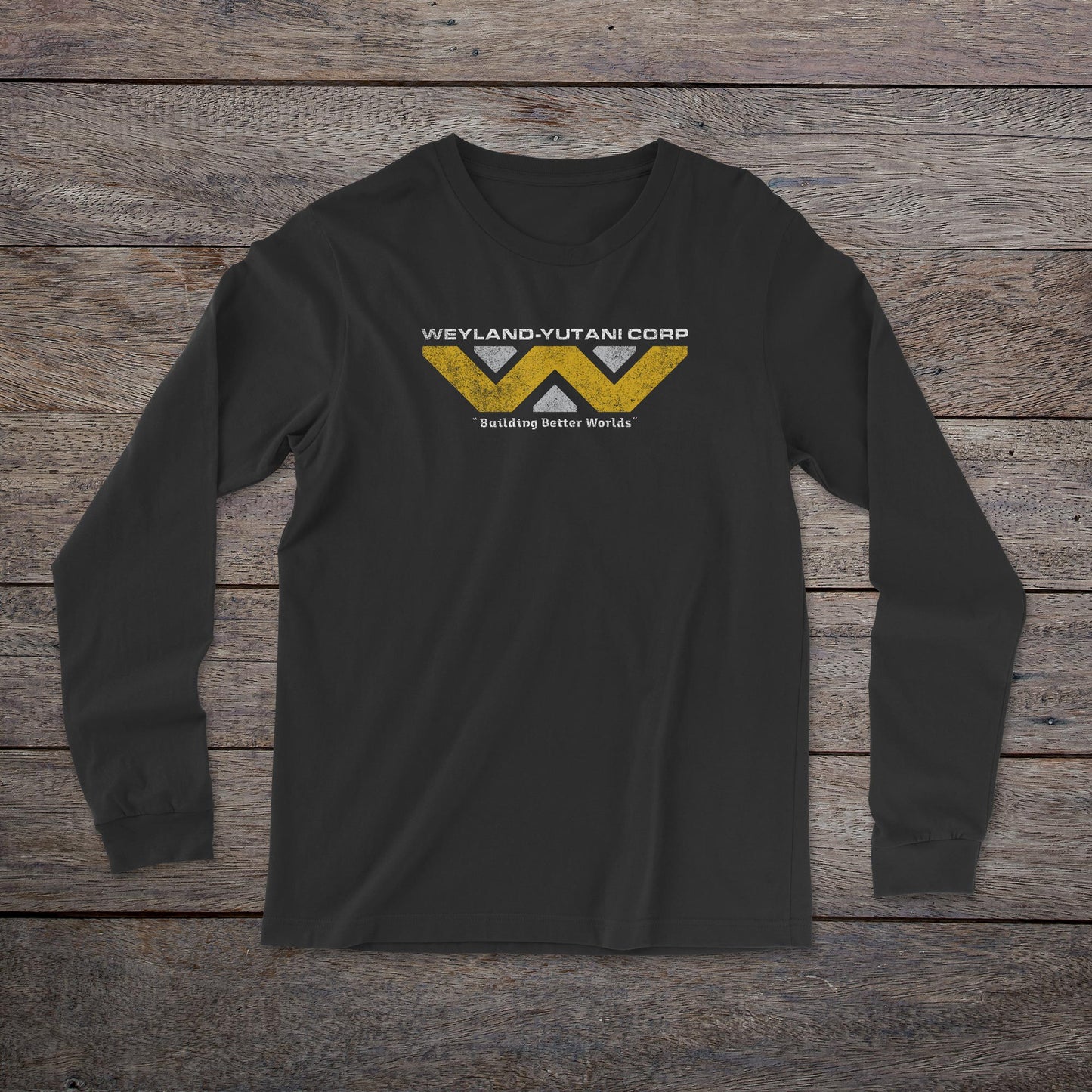 Front view of a black colored soft unisex Bella-Canvas 3501 long-sleeve t-shirt featuring the fictional Weyland-Yutani logo from the movie Alien and Aliens franchise in a vintage distressed style, sold by ScriptedBrand.