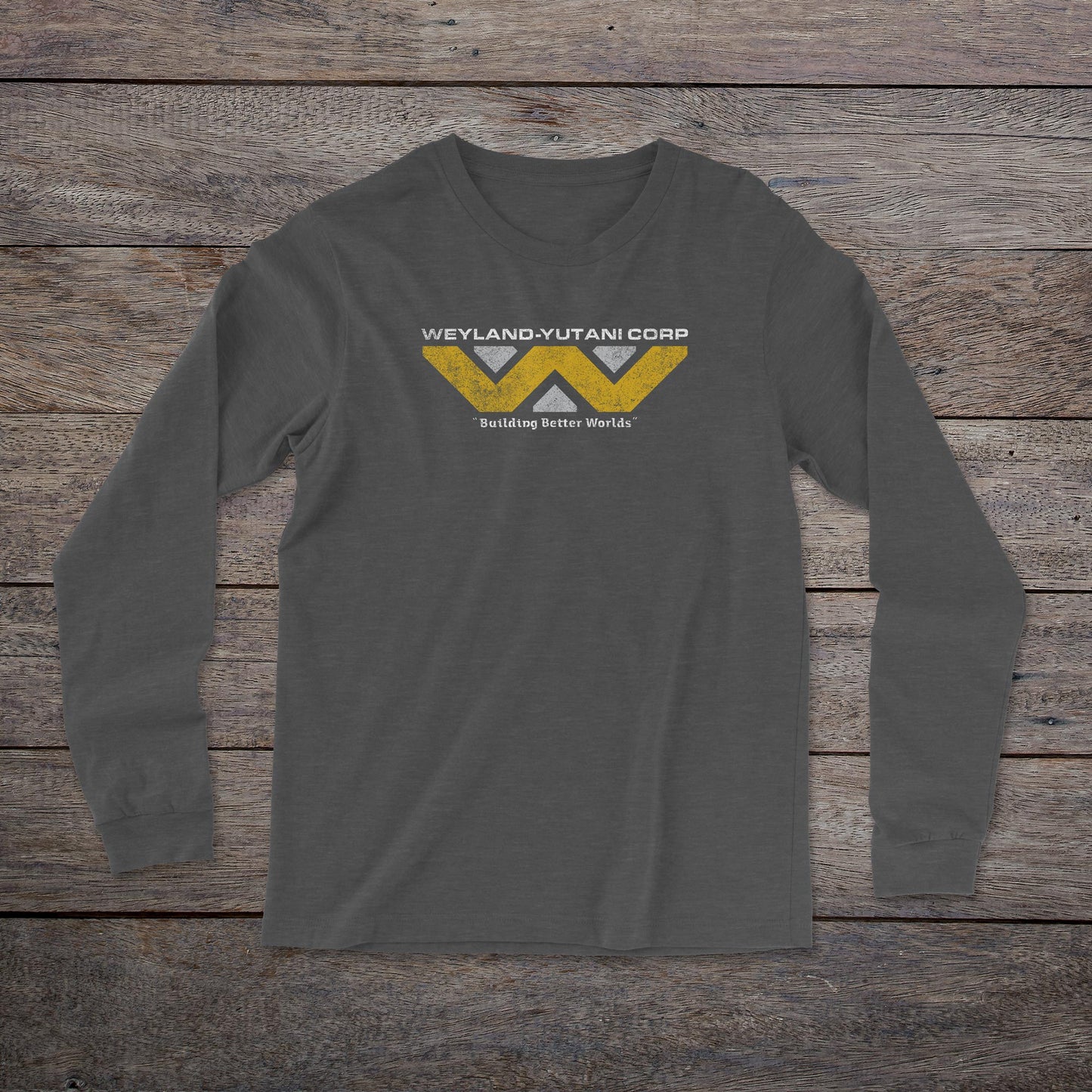 Front view of a dark grey heather colored soft unisex Bella-Canvas 3501 long-sleeve t-shirt featuring the fictional Weyland-Yutani logo from the movie Alien and Aliens franchise in a vintage distressed style, sold by ScriptedBrand.