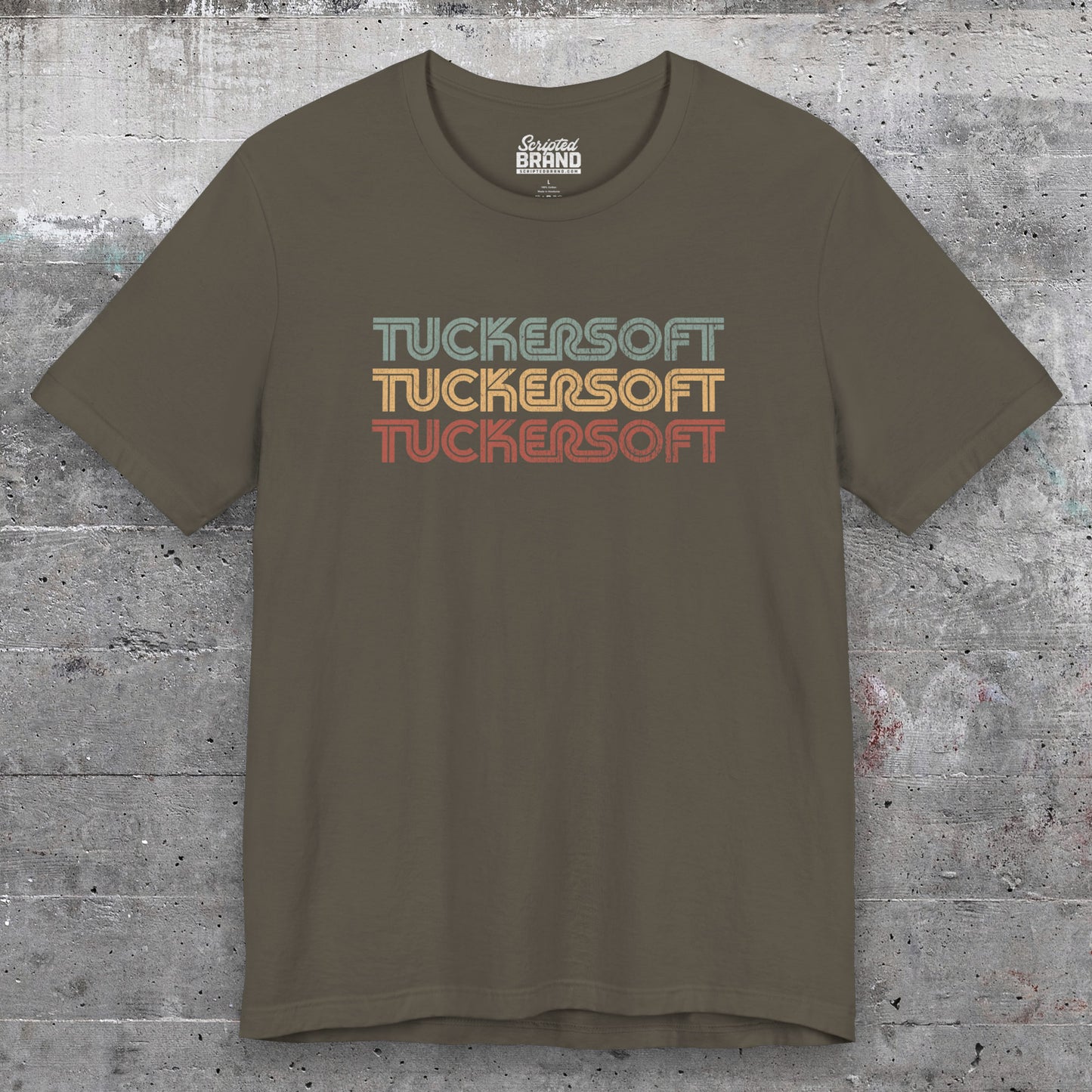 Front view of an army colored soft Bella+Canvas 3001 short-sleeve t-shirt tee featuring a logo graphic of the 1980s fictional video game company Tuckersoft inspired by the TV show Black Mirror and the episode Bandersnatch in a vintage distressed style, sold by ScriptedBrand.