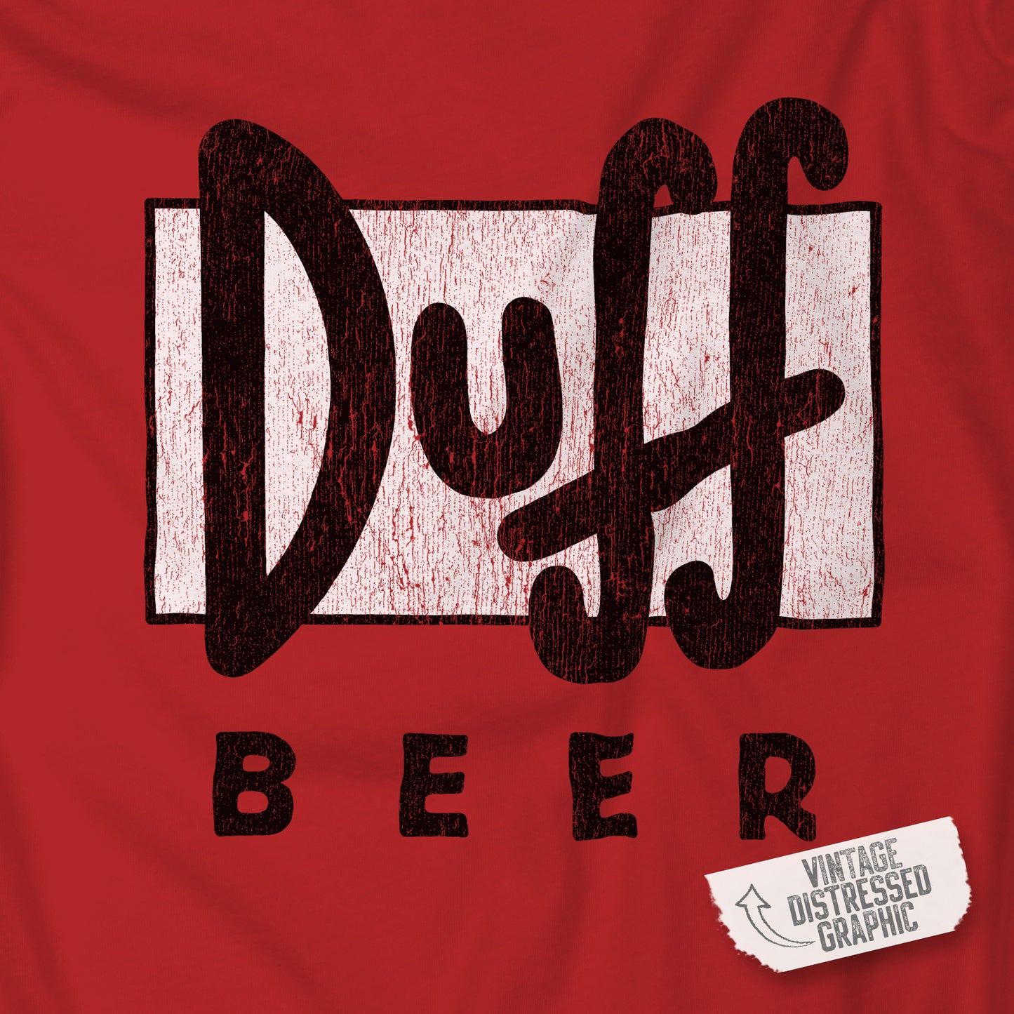 Closeup of red t-shirt featuring the Duff Beer logo from the TV Show The Simpsons in vintage distressed style.