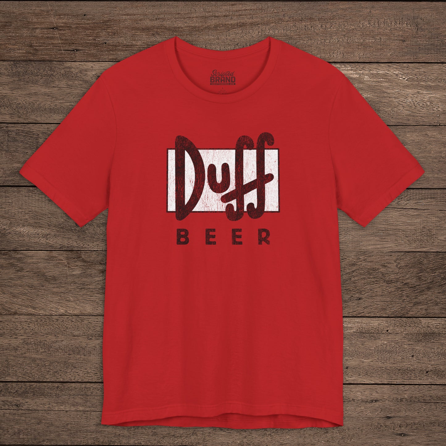 Red t-shirt featuring the Duff Beer logo from the TV Show The Simpsons in vintage distressed style.