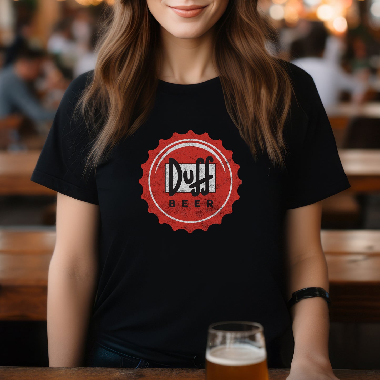 Woman wearing black t-shirt featuring the Duff Beer bottle cap logo from the TV Show The Simpsons in vintage distressed style.