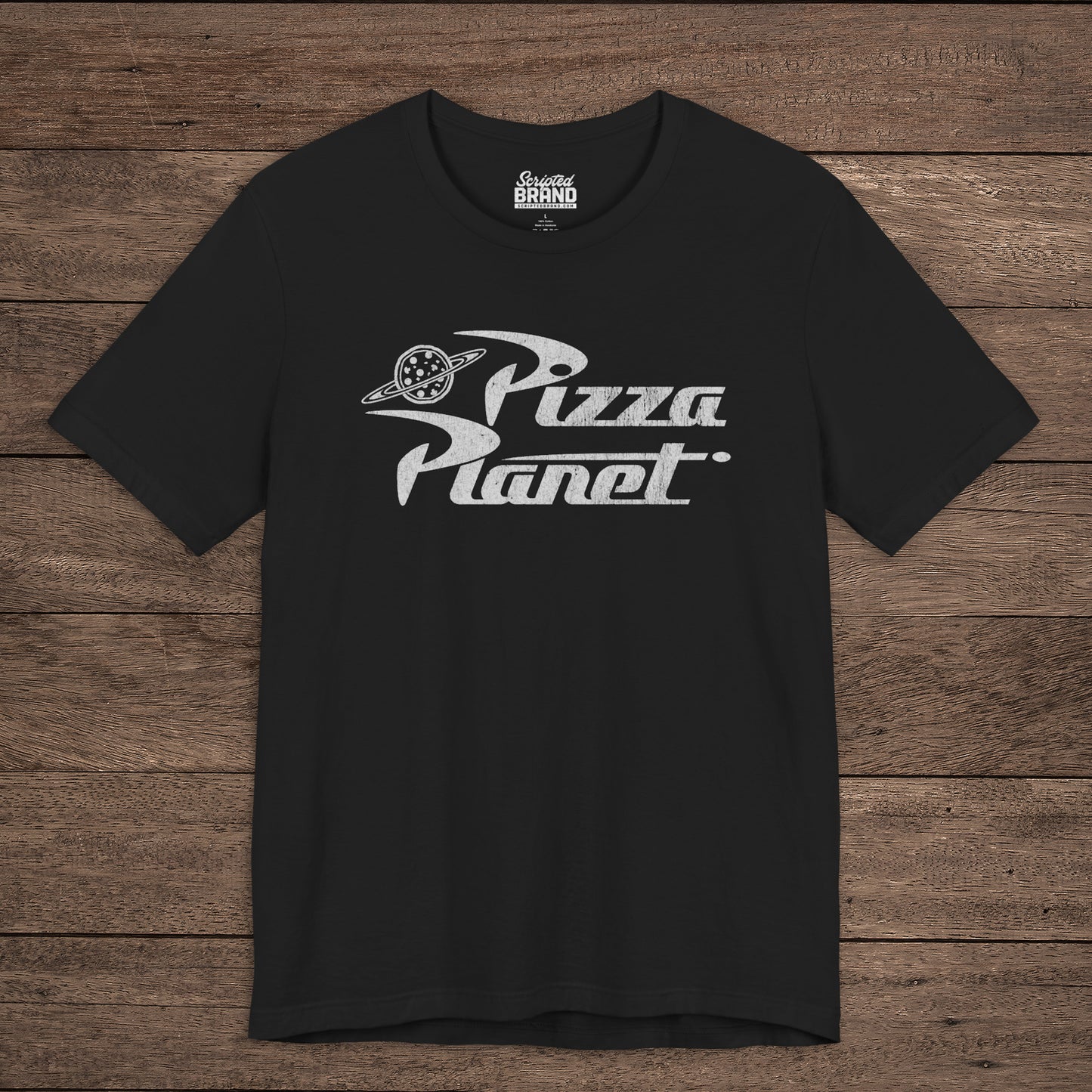 Front of black t-shirt with distressed white Pizza Planet logo inspired by the Toy Story movies.