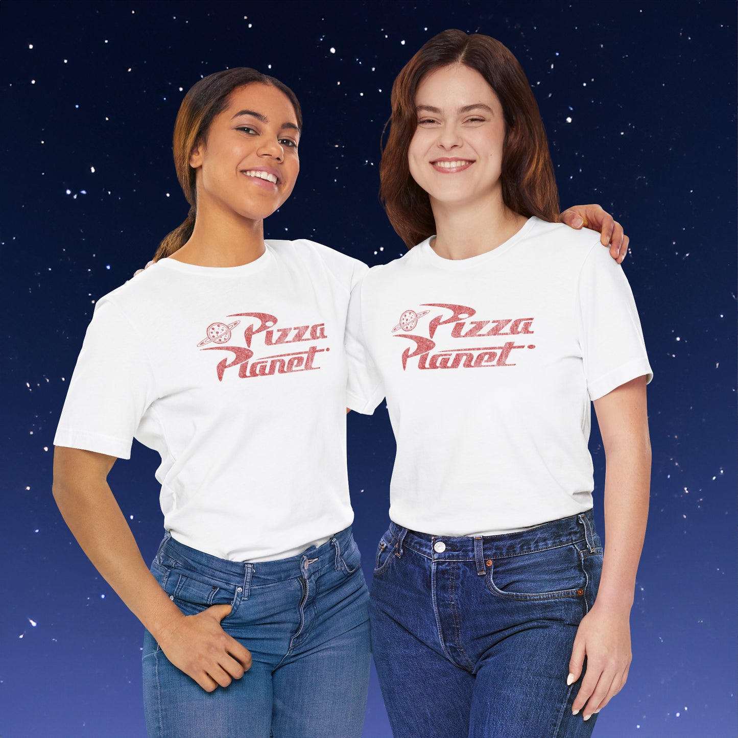 Two women wearing white t-shirts with distressed red Pizza Planet logo inspired by the Toy Story movies.