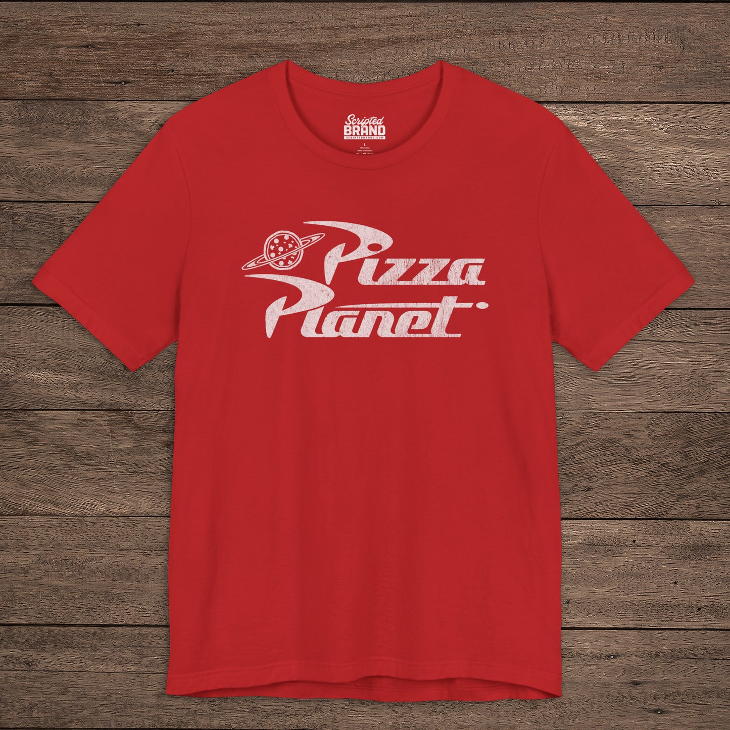 Front of red t-shirt with distressed white Pizza Planet logo inspired by the Toy Story movies.