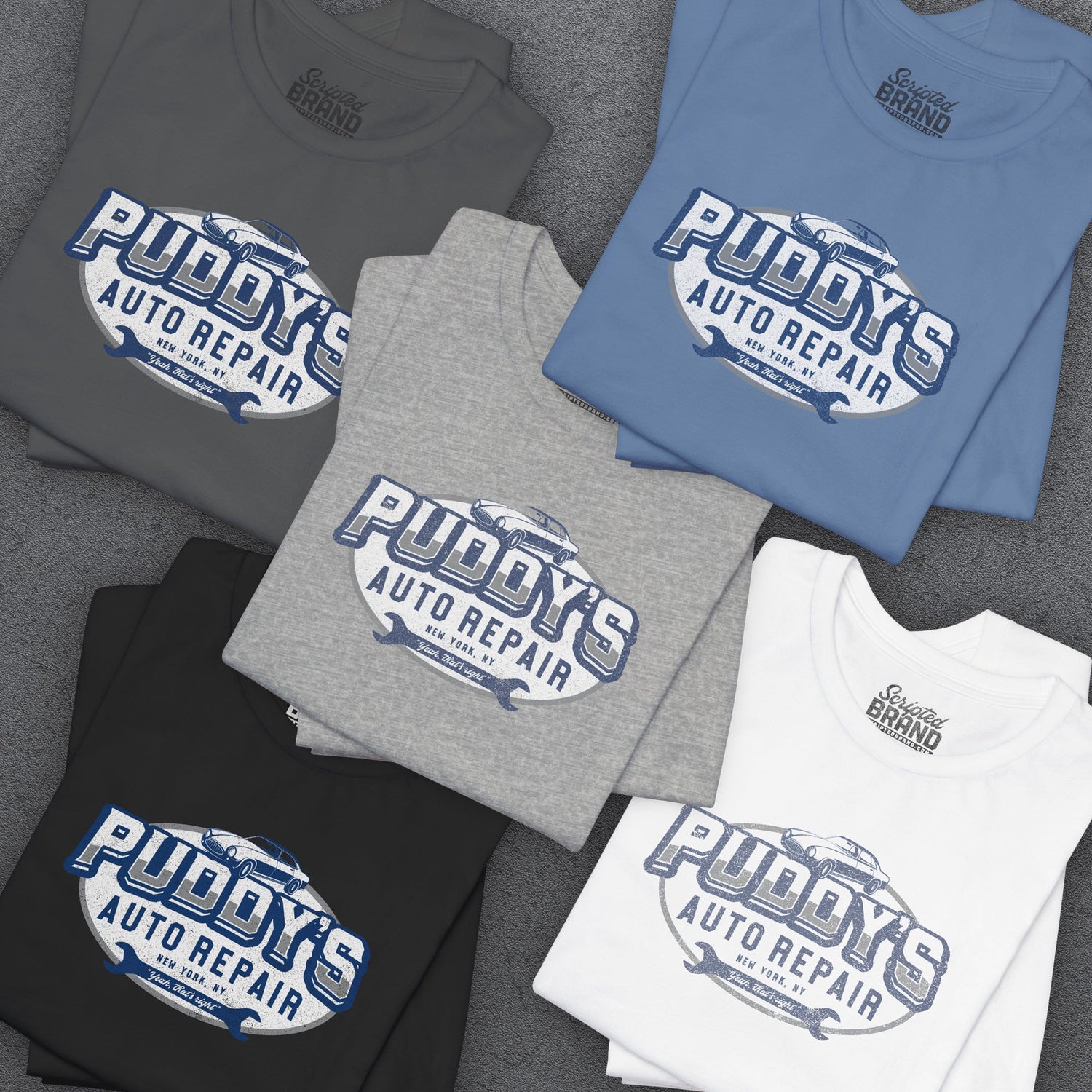 Group of 5 folded Soft Bella+Canvas 3001 short-sleeve t-shirt featuring a Puddy's Auto Repair logo graphic, uniquely designed by ScriptedBrand, including the phrase "Yeah That's Right", inspired by the TV show Seinfeld and David Puddy.