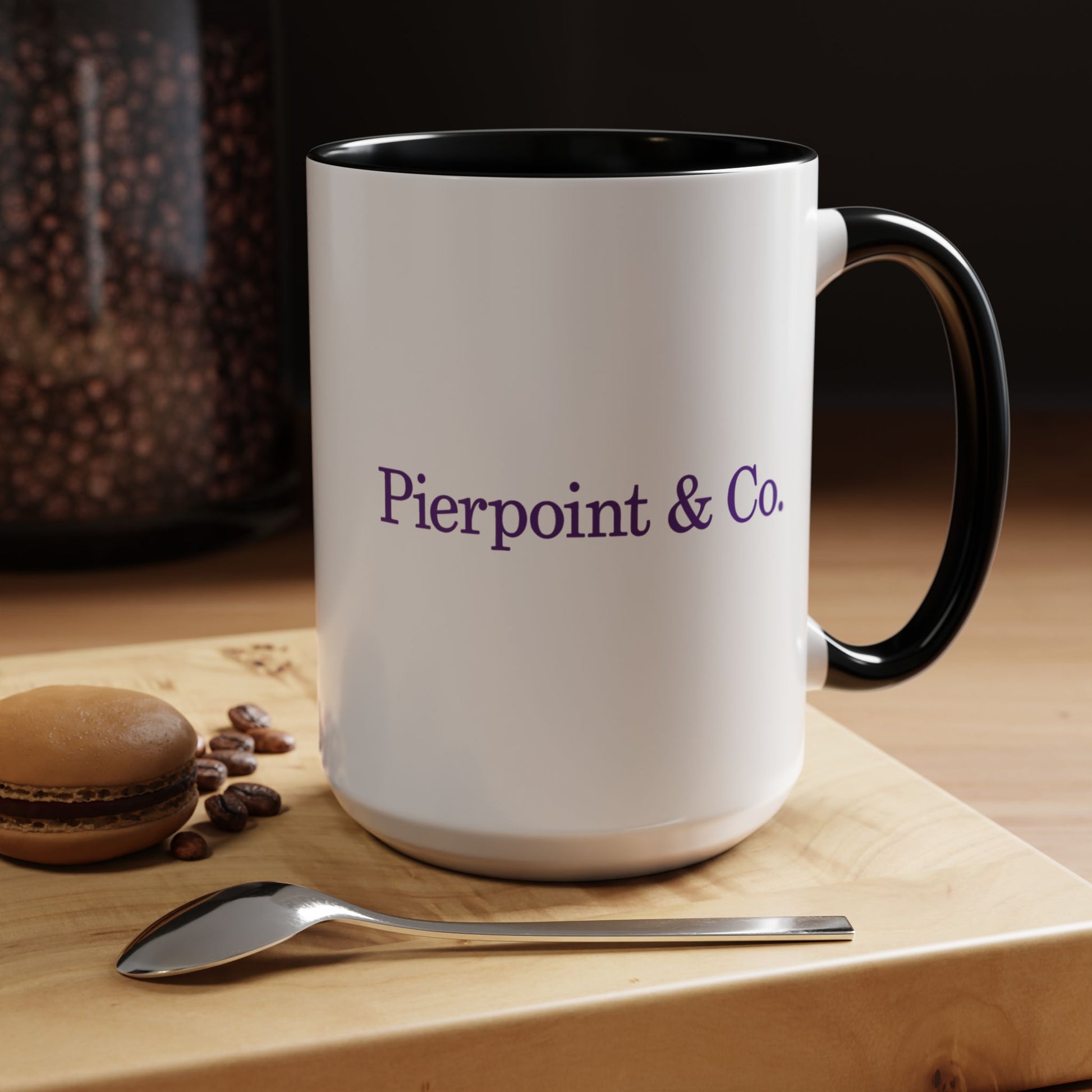 Kitchen image of a 15 oz White Ceramic Mug with black handle/interior featuring the purple Pierpoint & Co logo from the HBO TV show Industry printed on both sides, sold by ScriptedBrand.