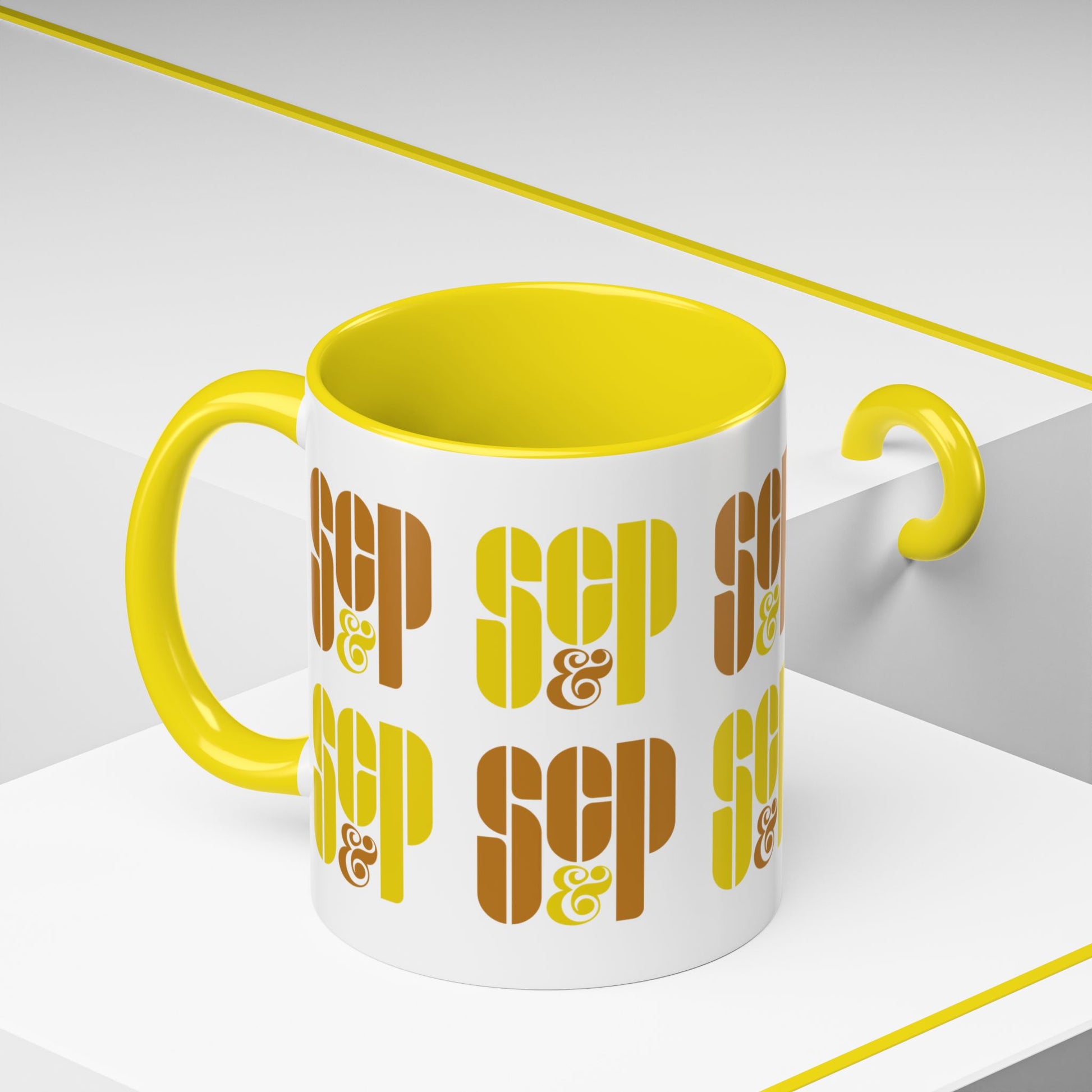 Angled view of a Mad Men 11 ounce white and yellow ceramic mug with a wraparound graphic of Sterling Cooper & Partners logos