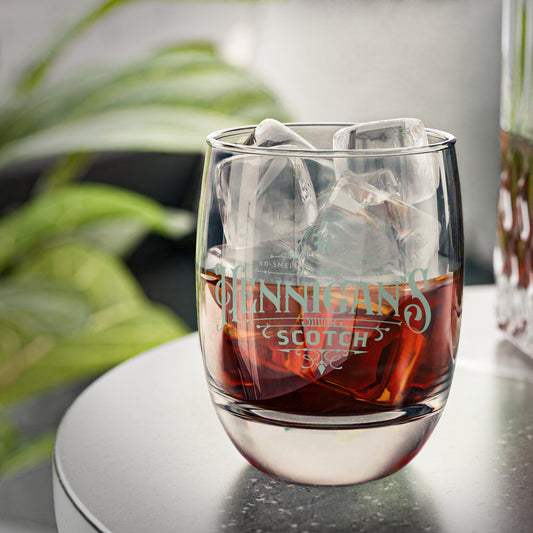 Half-filled 6 ounce Whiskey Glass with Hennigan's Scotch logo designed by ScriptedBrand from the TV show Seinfeld.