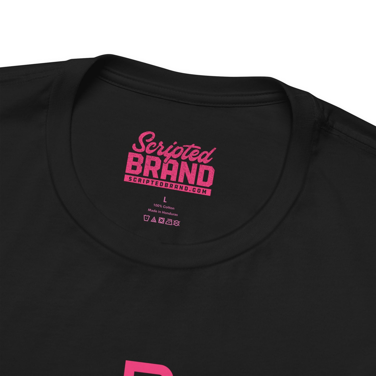 Closeup view of the neck tag of a black colored soft Bella+Canvas 3001 short-sleeve t-shirts featuring a pink logo graphic of the fictional Pink Motel inspired by the TV series Squid Game, in a vintage distressed style, sold by ScriptedBrand.