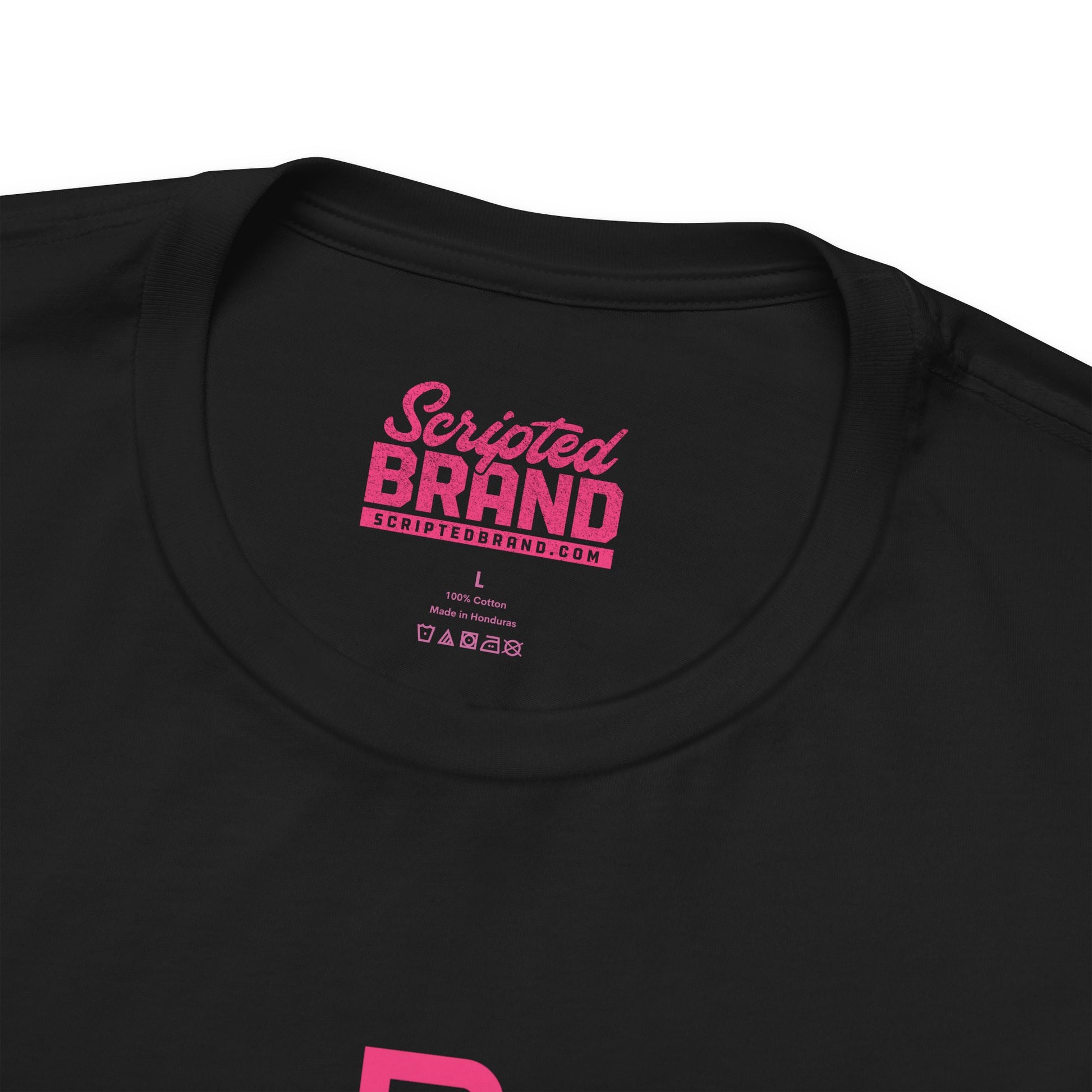 Closeup view of the neck tag of a black colored soft Bella+Canvas 3001 short-sleeve t-shirts featuring a pink logo graphic of the fictional Pink Motel inspired by the TV series Squid Game, in a vintage distressed style, sold by ScriptedBrand.