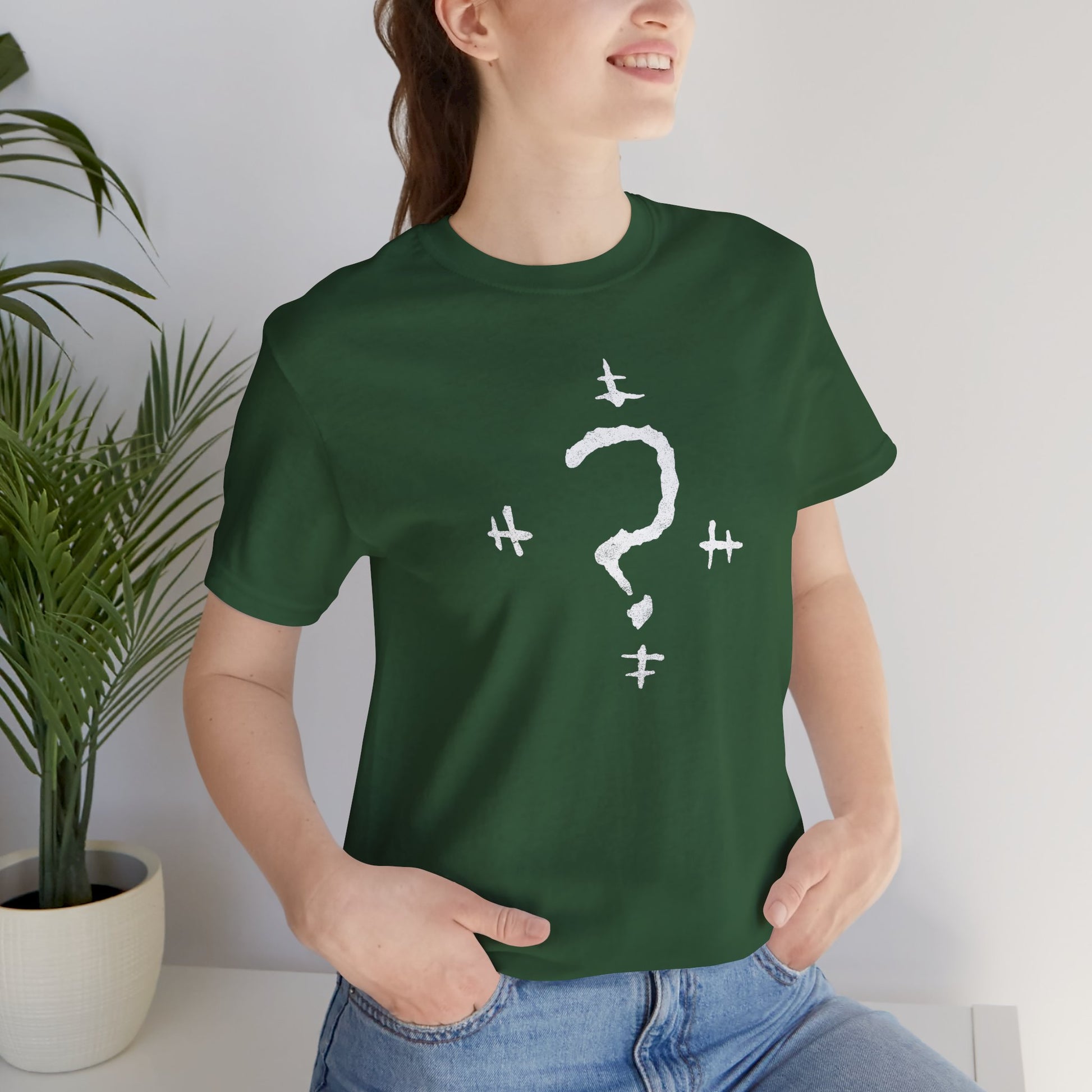 Woman wearing a Green t-shirt featuring the Riddler Question Mark logo from the movie The Batman in vintage distressed style.