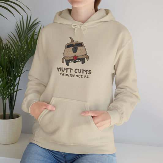 Female model wearing a sand colored soft Unisex Hoodie Heavy Blend Hooded Sweatshirt featuring a Mutt Cutts logo graphic inspired by the movie Dumb and Dumber, illustrated by ScriptedBrand in a vintage distressed style.