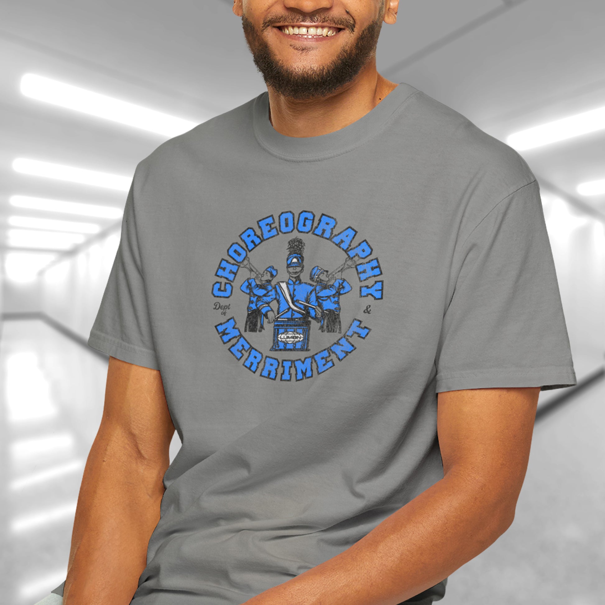 model wearing granite t-shirt with vintage graphic of Severance’s Choreography & Merriment Dept in blue on Comfort Colors 1717 tee.
