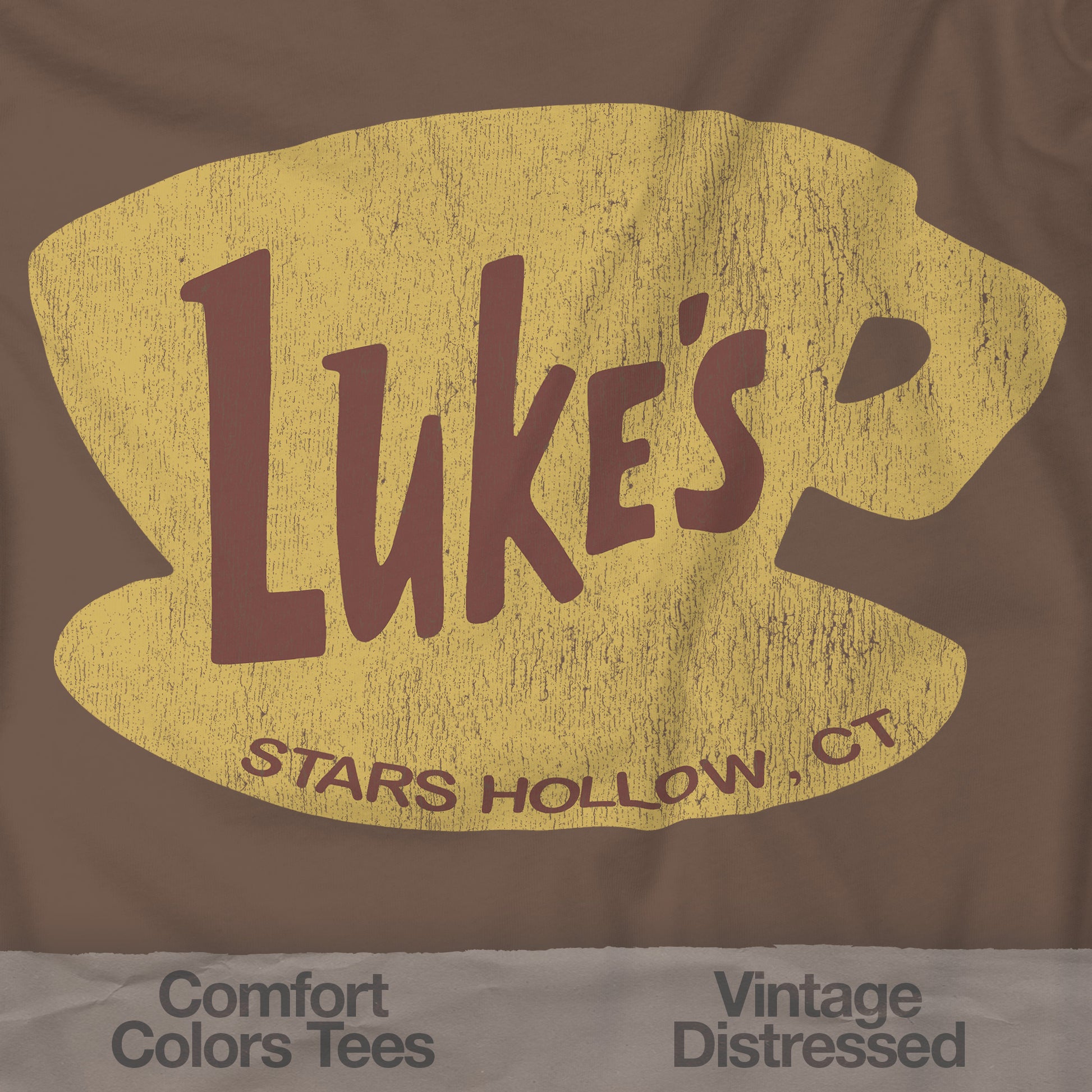 Closeup of Espresso brown Comfort Colors t-shirt with vintage yellow Luke’s Diner logo from Gilmore Girls.