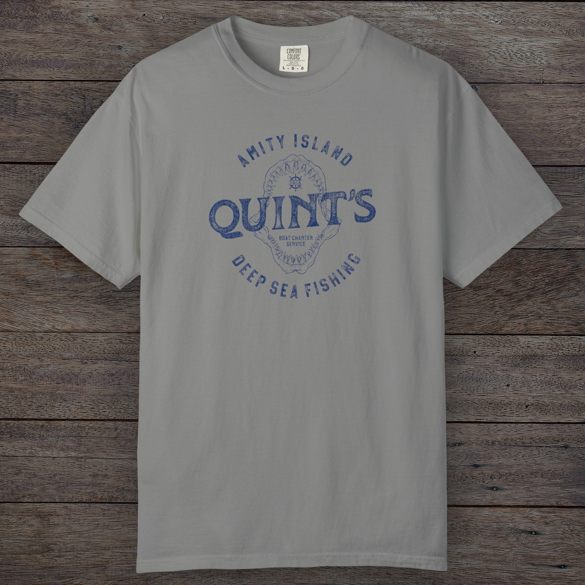 Granite Comfort Colors t-shirt with vintage Quint’s Deep Sea Fishing logo from Jaws, featuring shark graphic, distressed style.