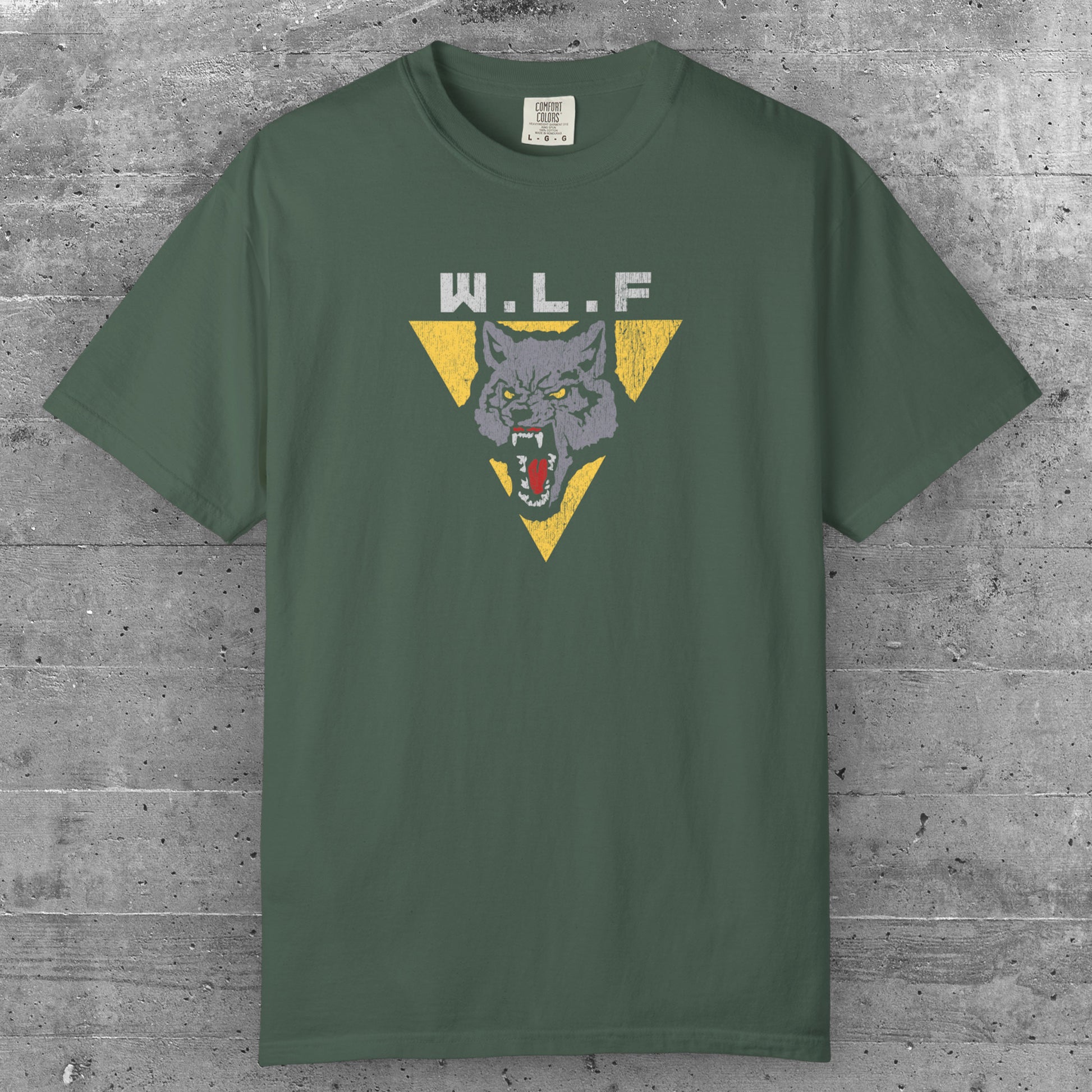 Blue Spruce t-shirt with distressed WLF logo from The Last of Us, featuring a snarling wolf inside a yellow triangle.
