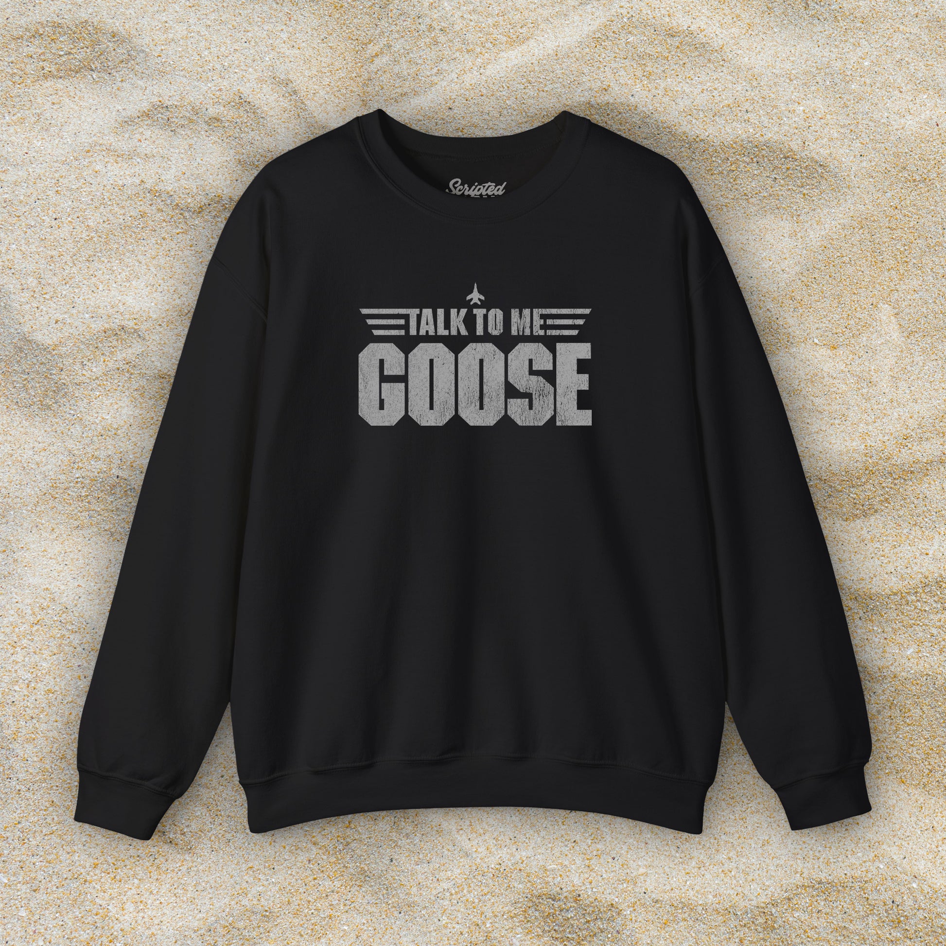 Front view of black crewneck sweatshirt with distressed “Talk to Me Goose” graphic, inspired by the movie Top Gun.
