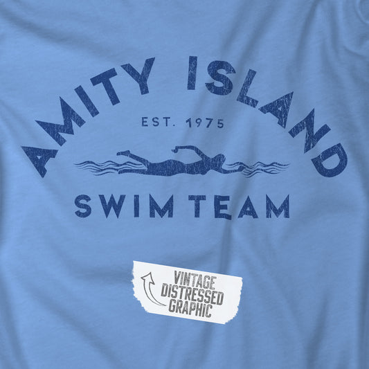 Closeup view of a Carolina Blue colored Soft Unisex Hoodie Heavy Blend Hooded Sweatshirt featuring an Amity Island Swim Team logo graphic, designed by ScriptedBrand, and  inspired by the movie Jaws in a vintage distressed style.