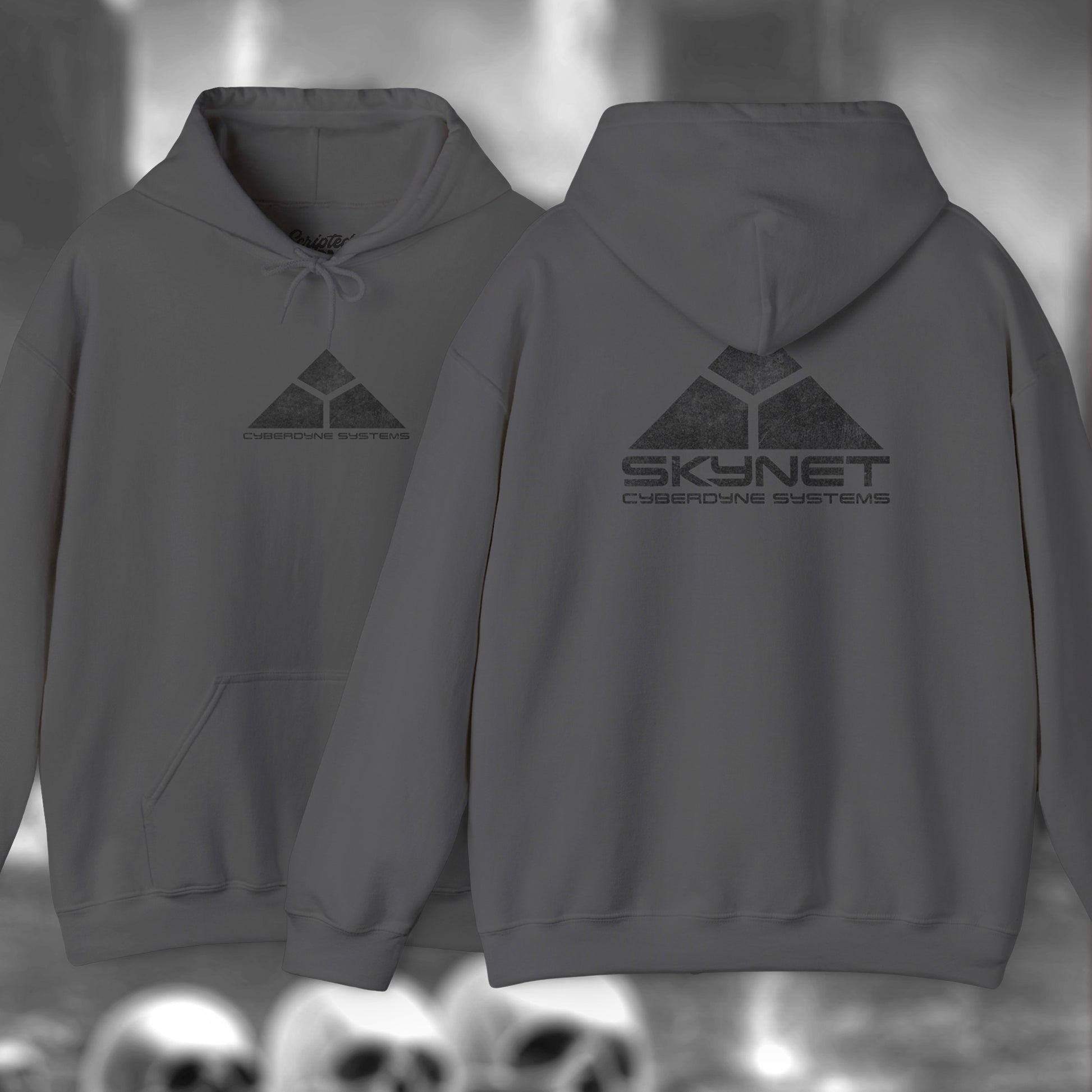 Charcoal Gray Hoodie Sweatshirt featuring the fictional logo Skynet Cyberdyne Systems from the movie The Terminator printed on front and back in a vintage distressed style.