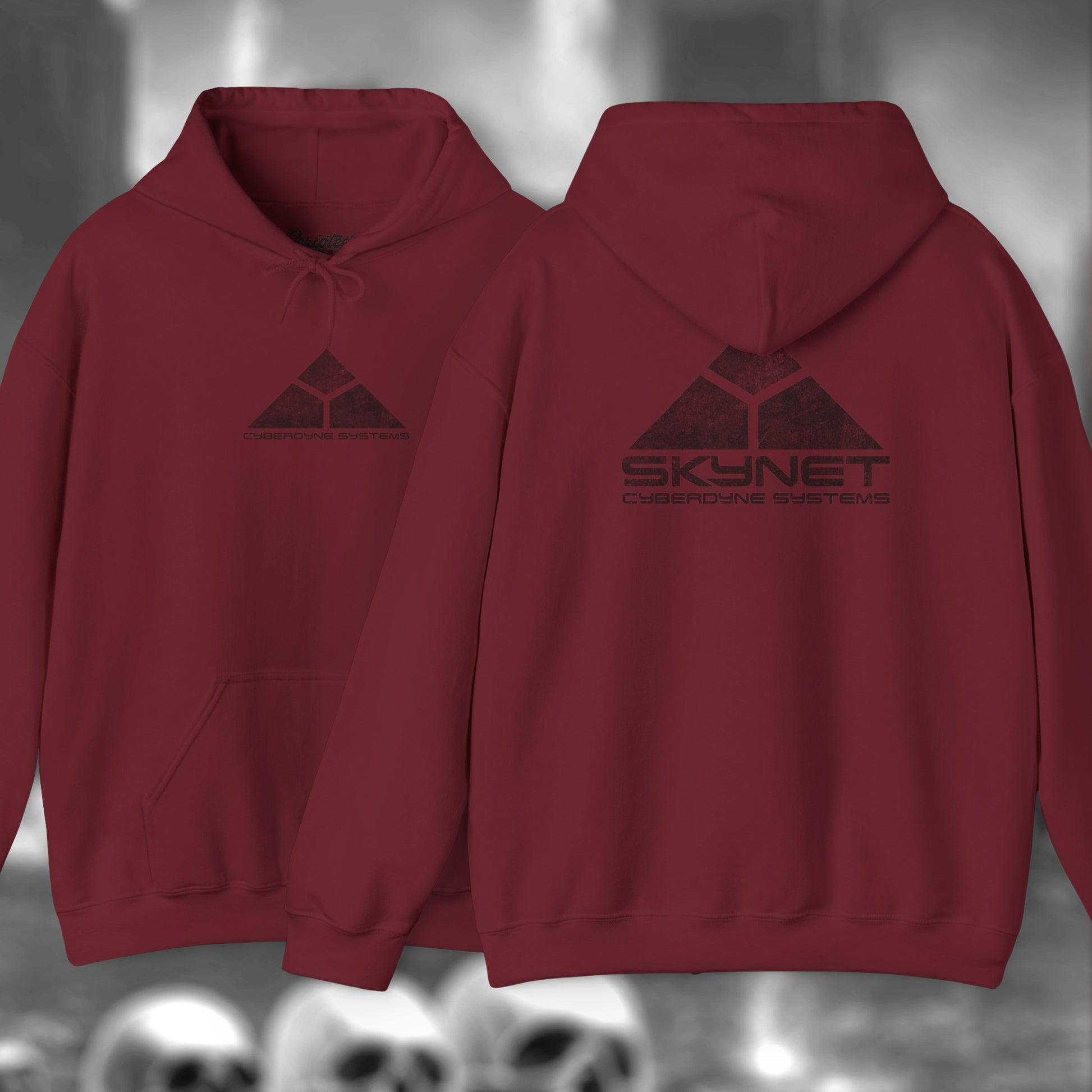 Garnet red Hoodie Sweatshirt featuring the fictional logo Skynet Cyberdyne Systems from the movie The Terminator printed on both sides in a vintage distressed style.