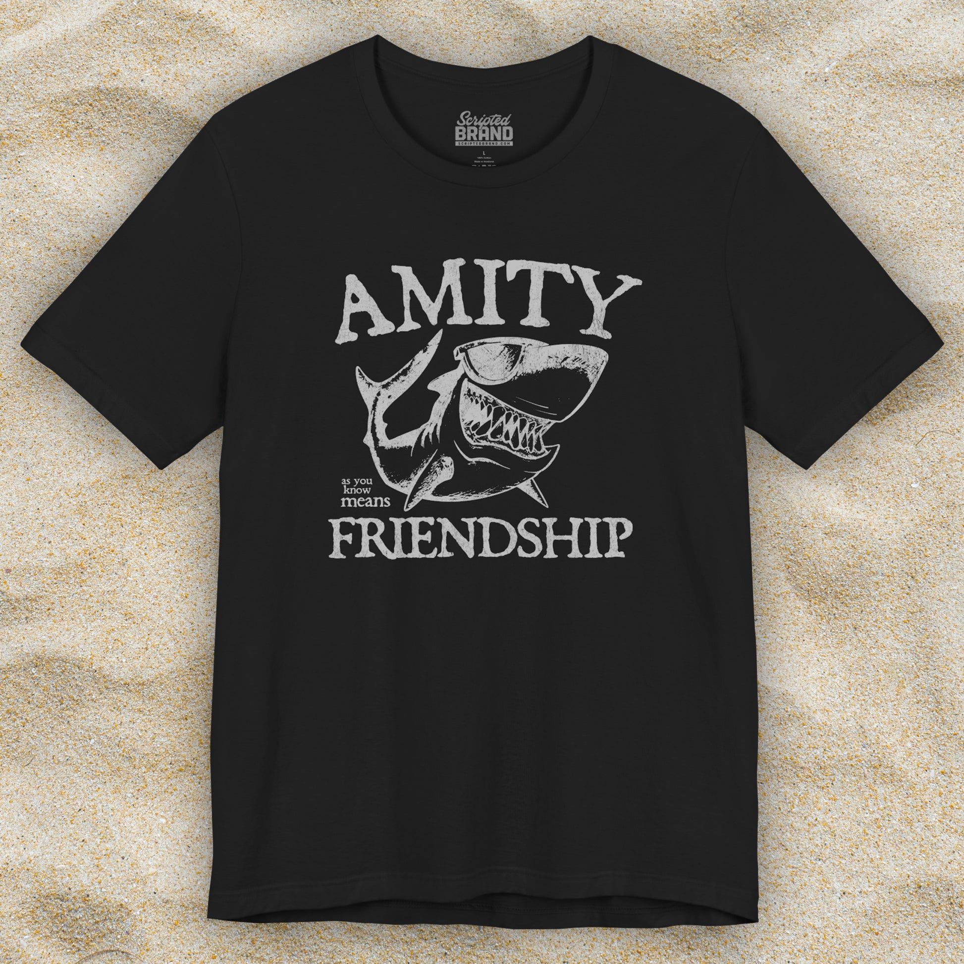 Black Bella+Canvas t-shirt with a vintage-style Amity Island “Friendship” shark graphic inspired by the movie Jaws
