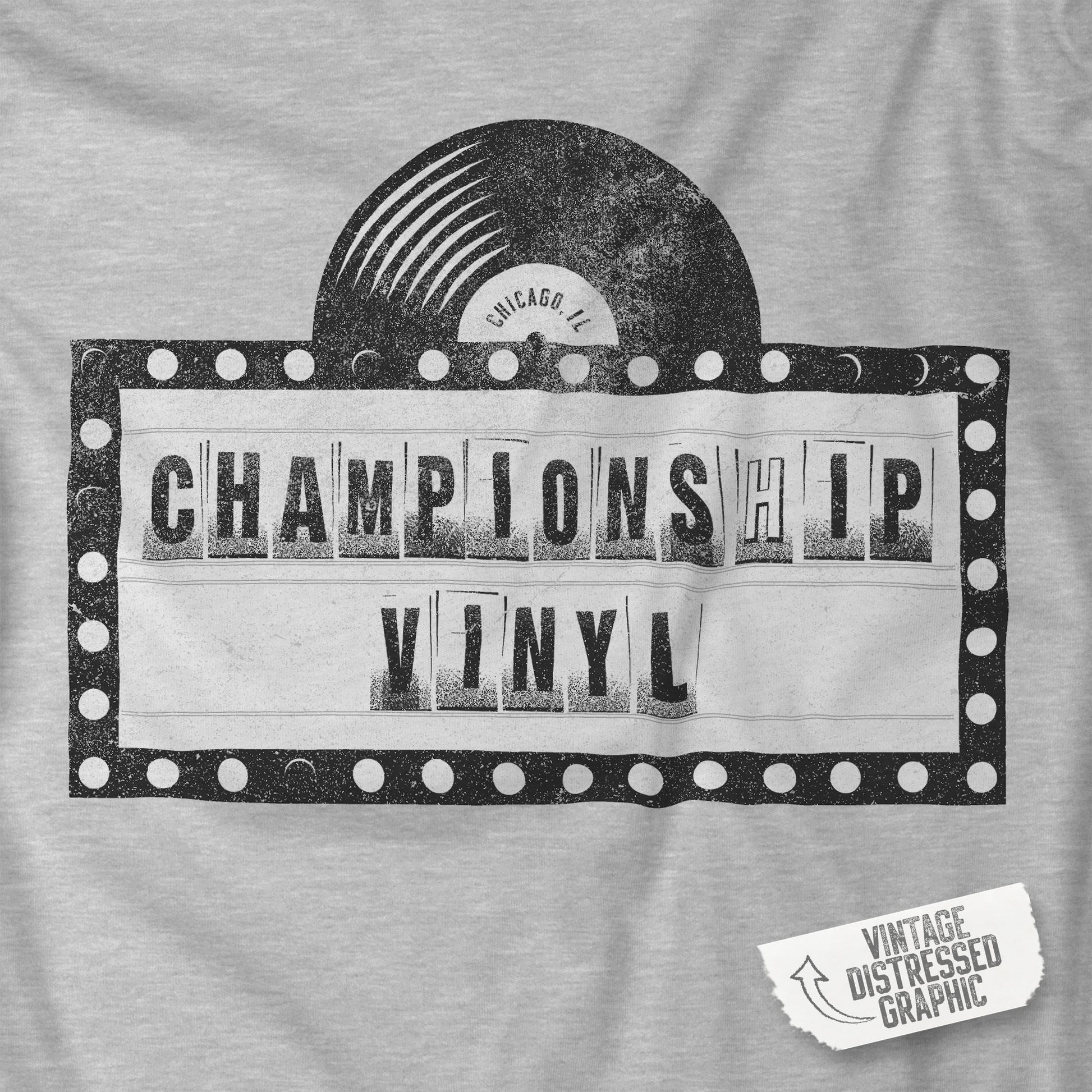 Closeup of Heather Gray t-shirt featuring the fictional logo CHAMPIONSHIP VINYL record store from movie High Fidelity in a vintage distressed style.
