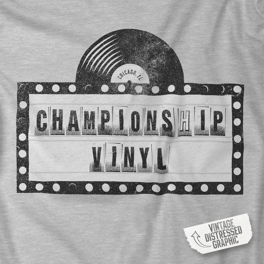 Closeup of Heather Gray t-shirt featuring the fictional logo CHAMPIONSHIP VINYL record store from movie High Fidelity in a vintage distressed style.
